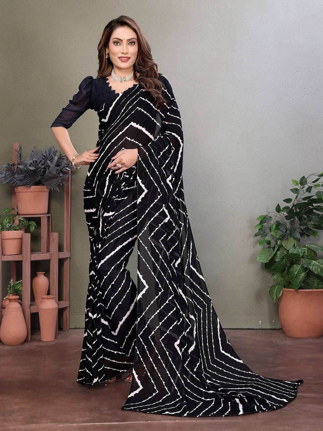 ANAND SAREES Georgette Printed Saree With Unstitched Blouse Piece ( Black ) ANAND SAREES Georgette Printed Saree With Unstitched Blouse Piece ( Black )