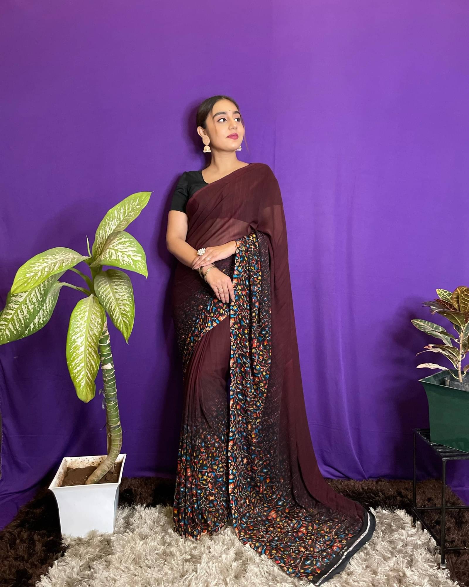 ANAND SAREES Georgette Printed Saree With Unstitched Blouse Piece ( Brown ) ANAND SAREES Georgette Printed Saree With Unstitched Blouse Piece ( Brown )