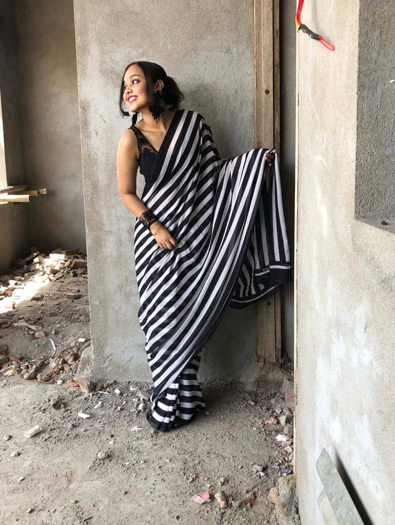 ANAND SAREES Georgette Printed Kasavu Saree With Unstitched Blouse Piece ( Black ) ANAND SAREES Georgette Printed Kasavu Saree With Unstitched Blouse Piece ( Black )