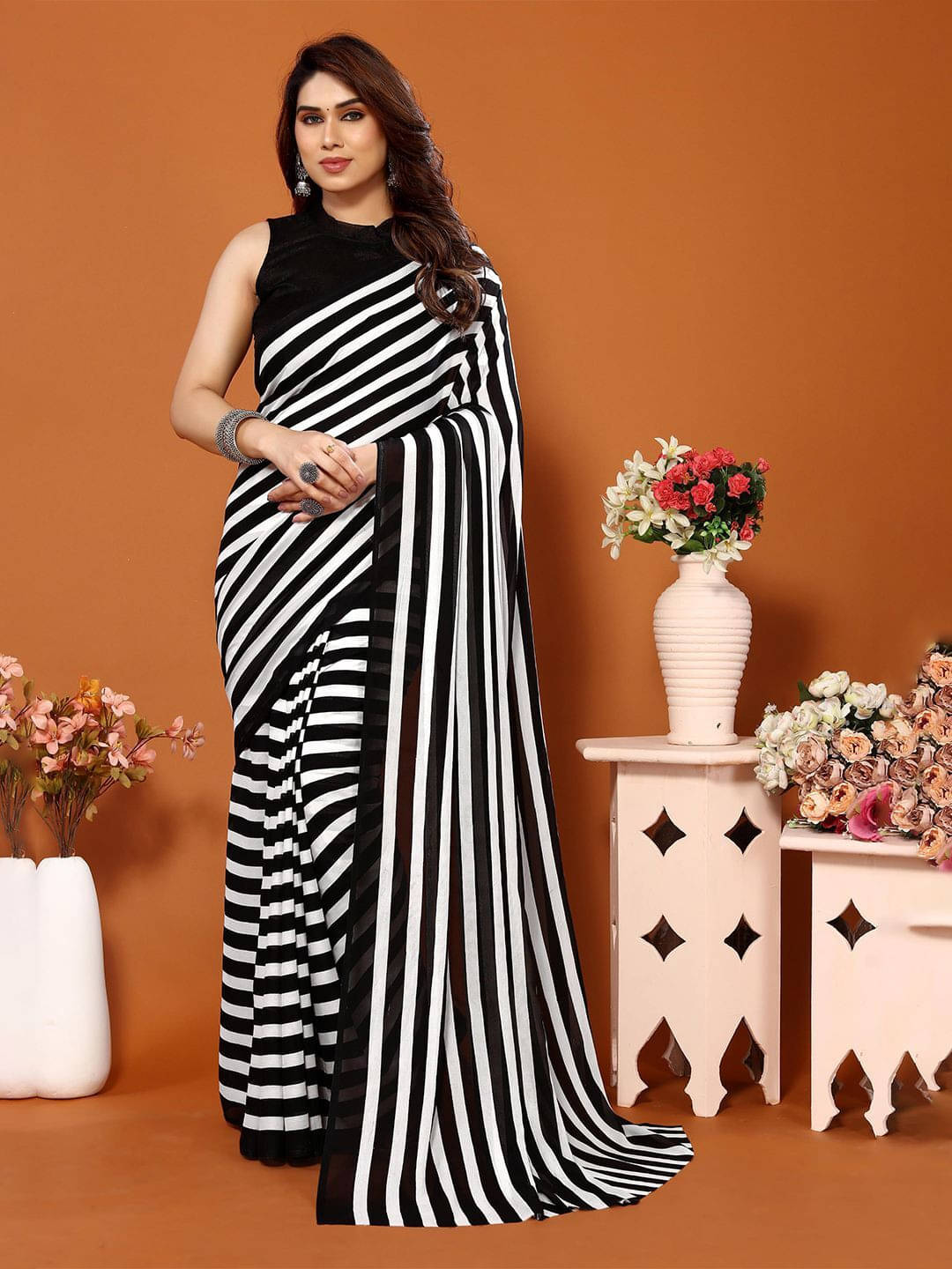 ANAND SAREES Georgette Printed Regular Saree With Unstitched Blouse Piece ( Black ) ANAND SAREES Georgette Printed Regular Saree With Unstitched Blouse Piece ( Black )