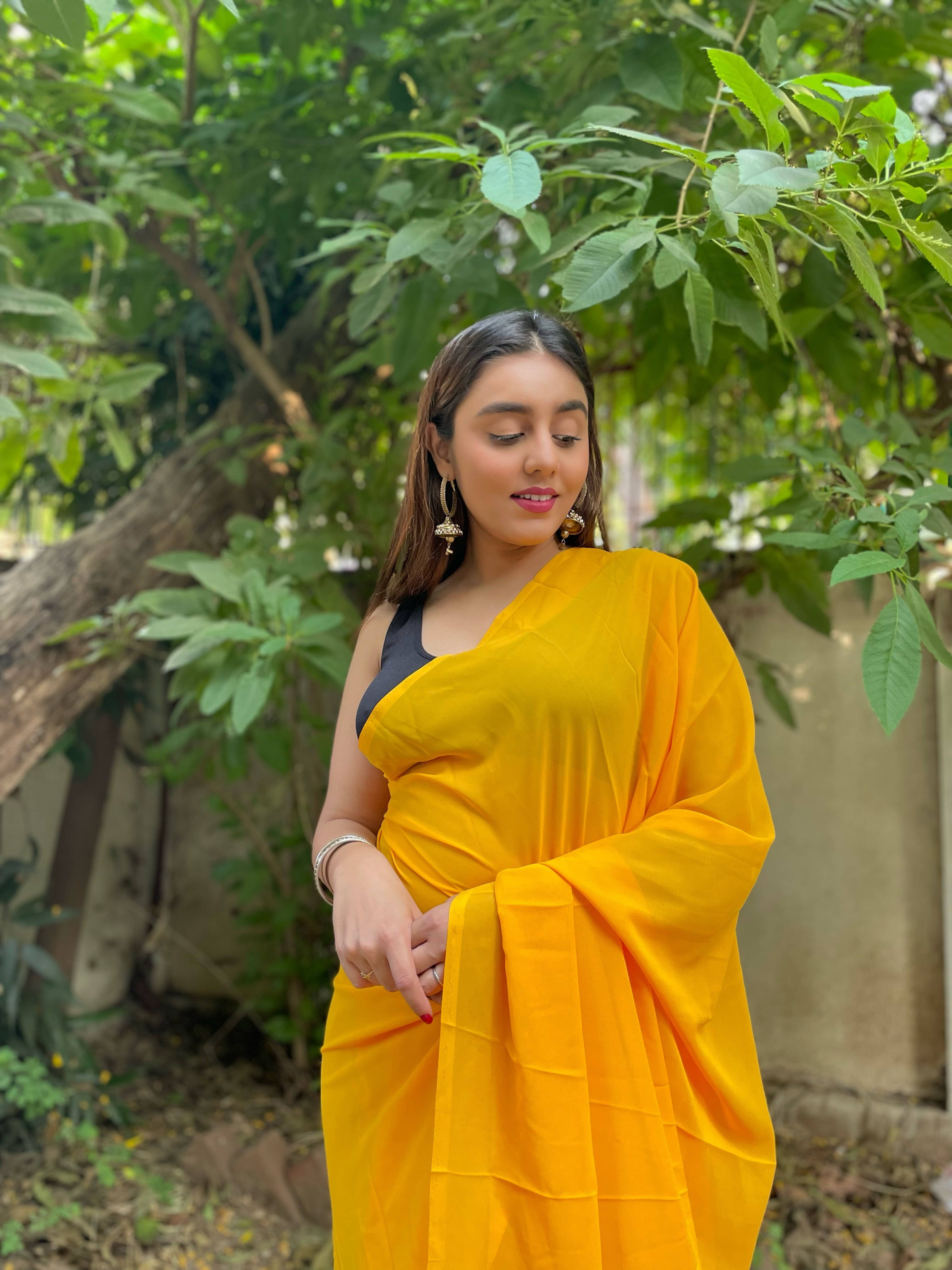ANAND SAREES Georgette Solid Regular Saree With Unstitched Blouse Piece ( Yellow ) ANAND SAREES Georgette Solid Regular Saree With Unstitched Blouse Piece ( Yellow )