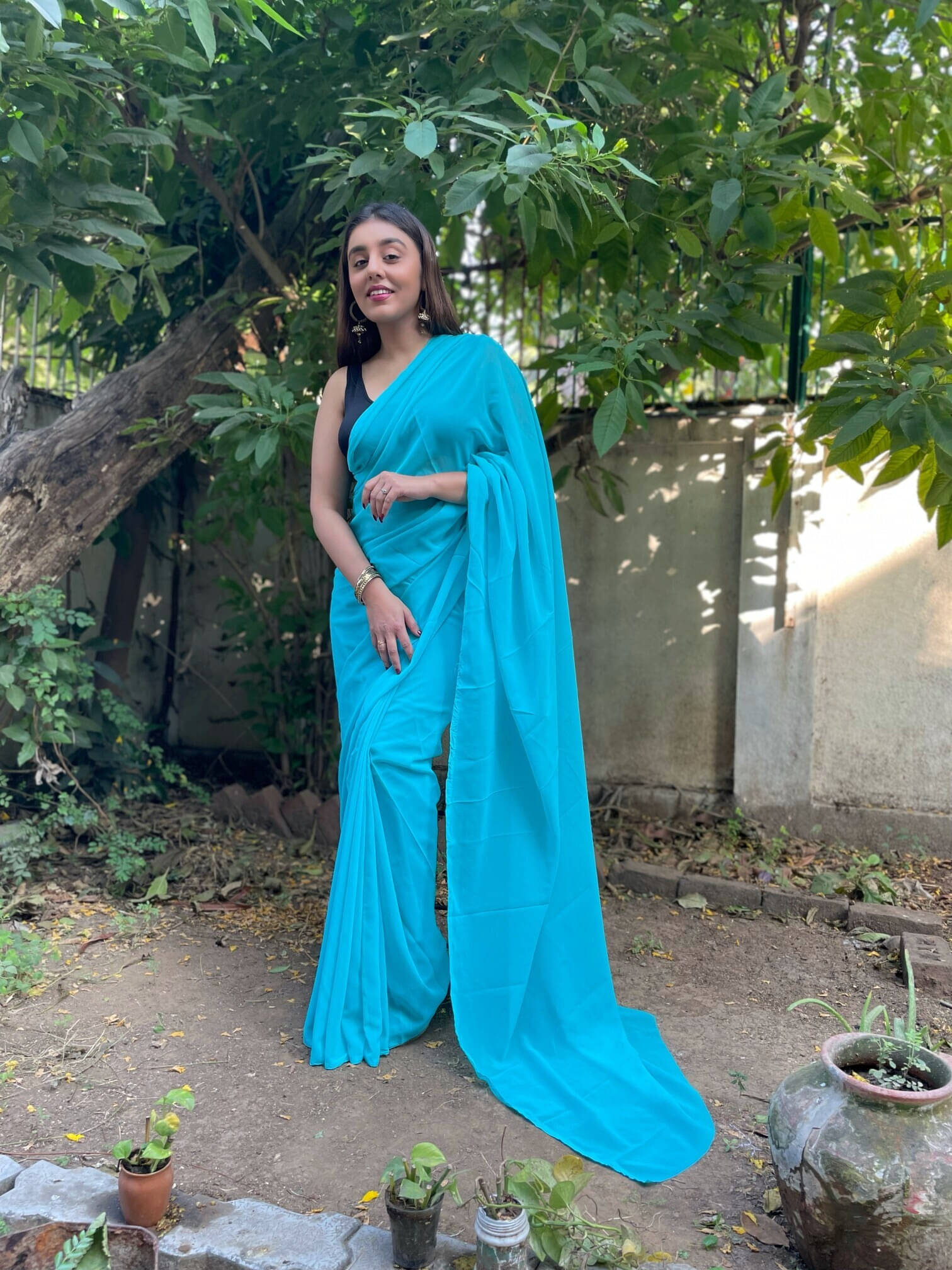 ANAND SAREES Georgette Solid Regular Saree With Unstitched Blouse Piece ( Light Blue ) ANAND SAREES Georgette Solid Regular Saree With Unstitched Blouse Piece ( Light Blue )
