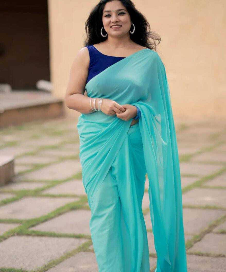 ANAND SAREES Georgette Solid Regular Saree With Unstitched Blouse Piece ( Light Blue ) ANAND SAREES Georgette Solid Regular Saree With Unstitched Blouse Piece ( Light Blue )