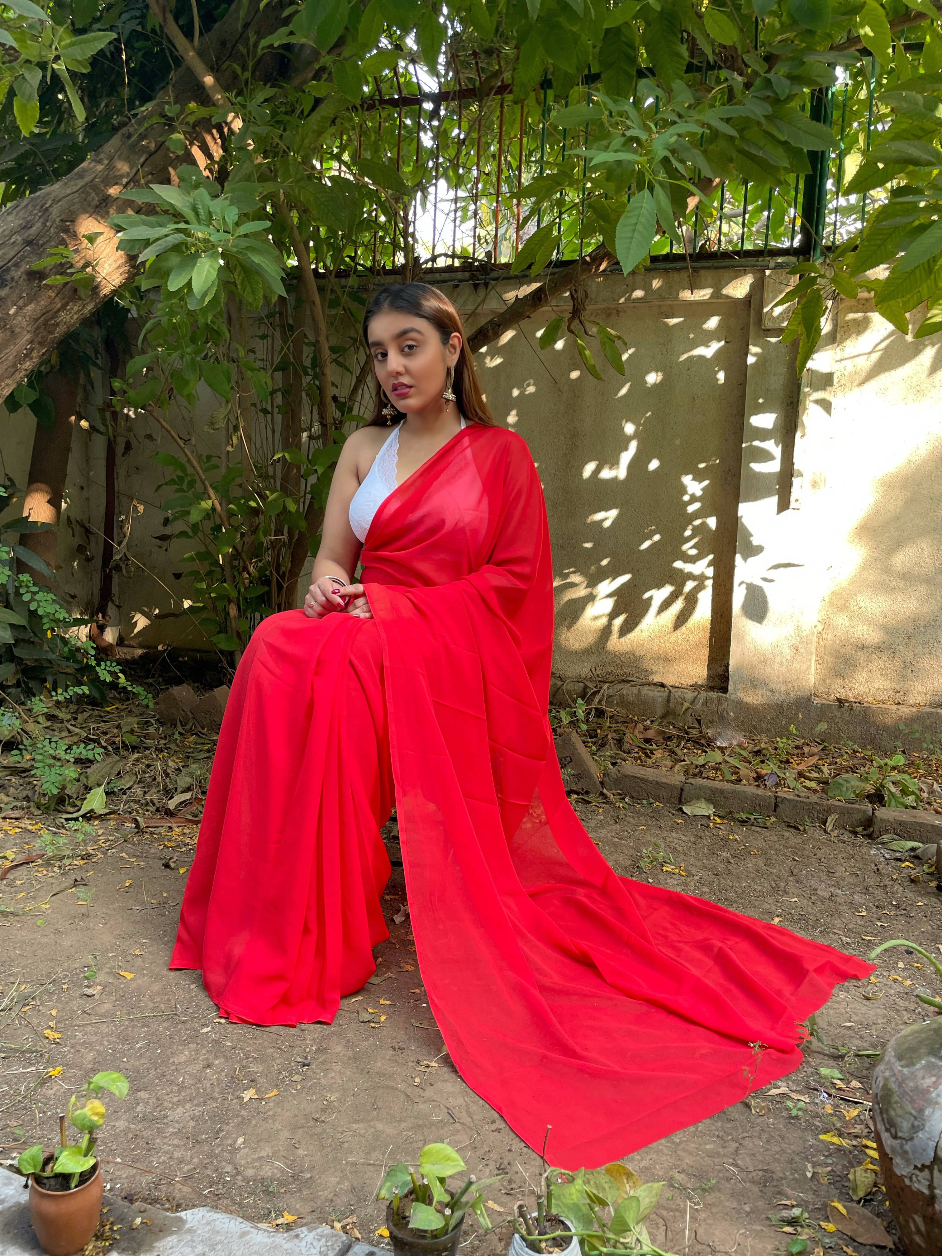 ANAND SAREES Georgette Solid Regular Saree With Unstitched Blouse Piece ( Red ) ANAND SAREES Georgette Solid Regular Saree With Unstitched Blouse Piece ( Red )