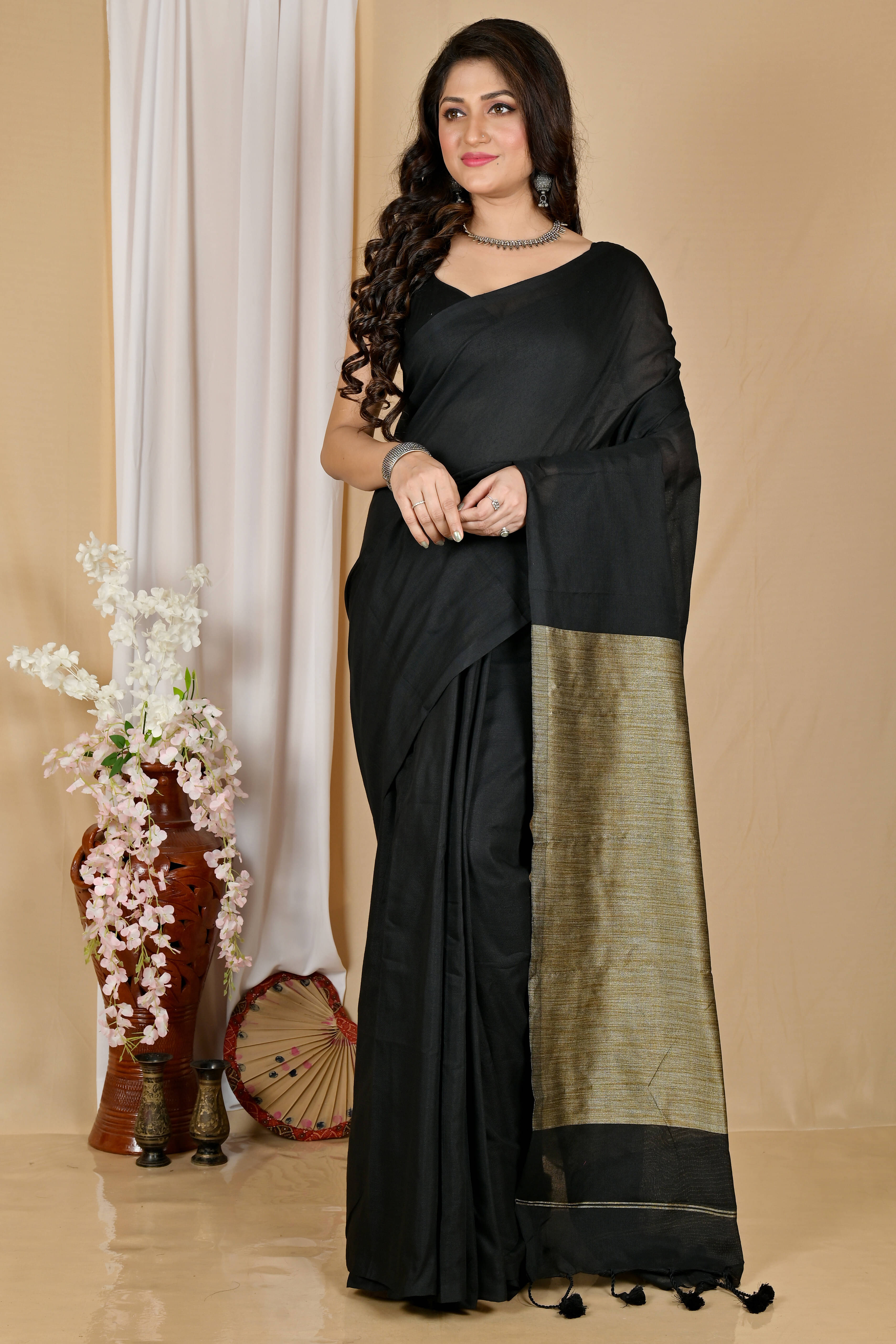 BRYNBRIT Cotton Blend Self Design Regular Saree Without Blouse Piece ( Black ) BRYNBRIT Cotton Blend Self Design Regular Saree Without Blouse Piece ( Black )