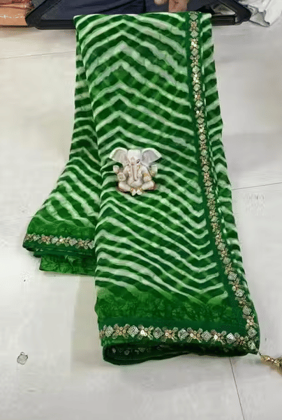 VAANISRI Georgette Printed Leheriya Saree With Unstitched Blouse Piece ( Green ) VAANISRI Georgette Printed Leheriya Saree With Unstitched Blouse Piece ( Green )