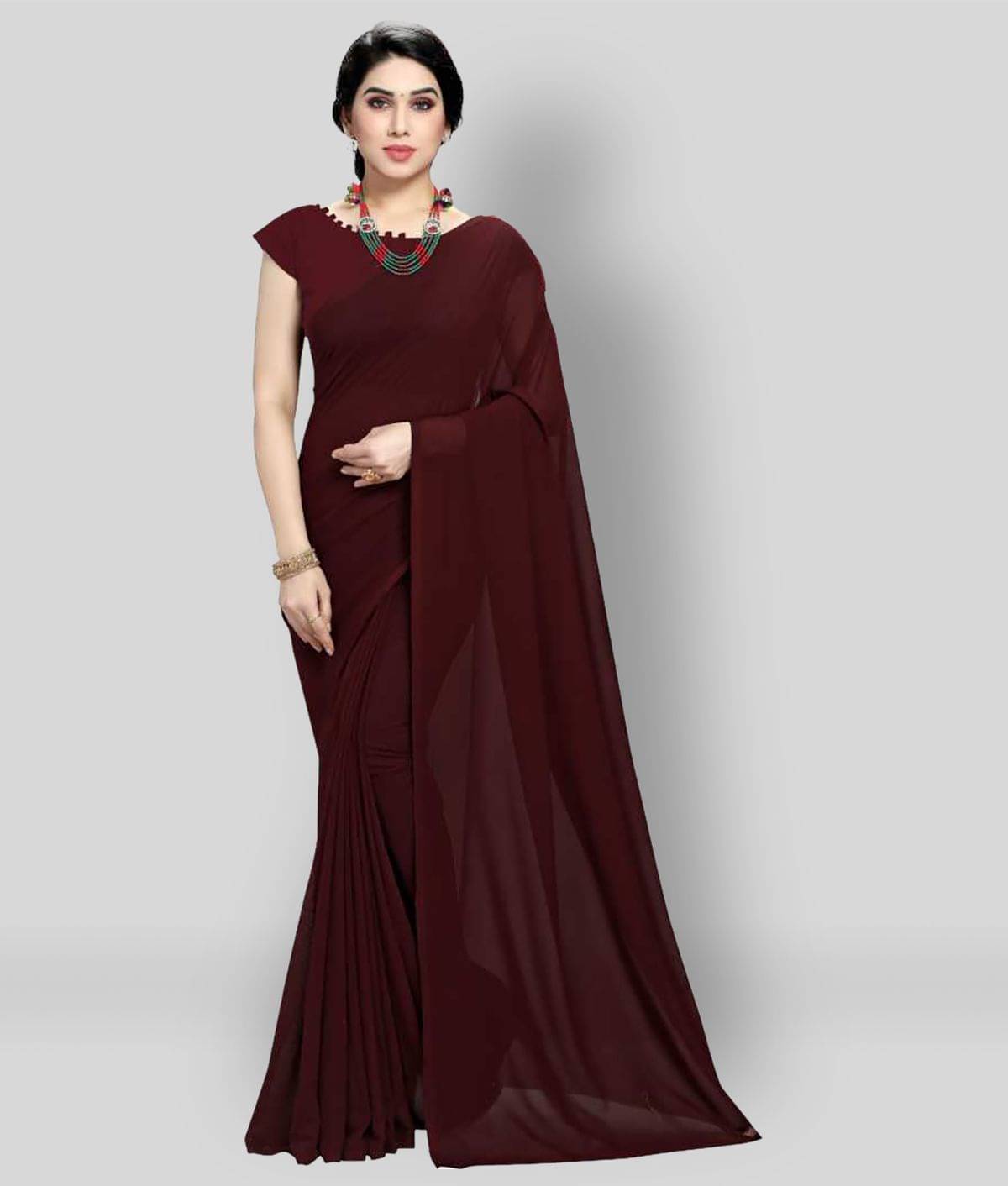 ANAND SAREES Georgette Solid Saree With Unstitched Blouse Piece ( Brown ) ANAND SAREES Georgette Solid Saree With Unstitched Blouse Piece ( Brown )