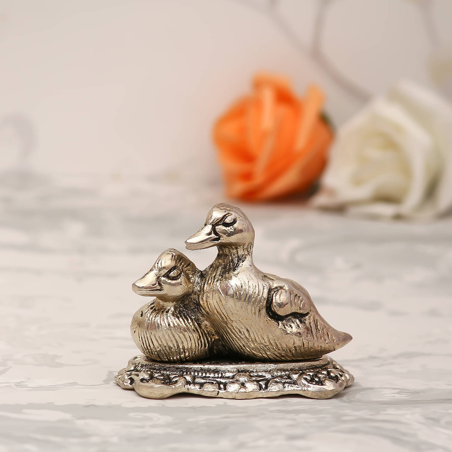     			eCraftIndia Gold-Toned Textured Loving Swans Showpiece