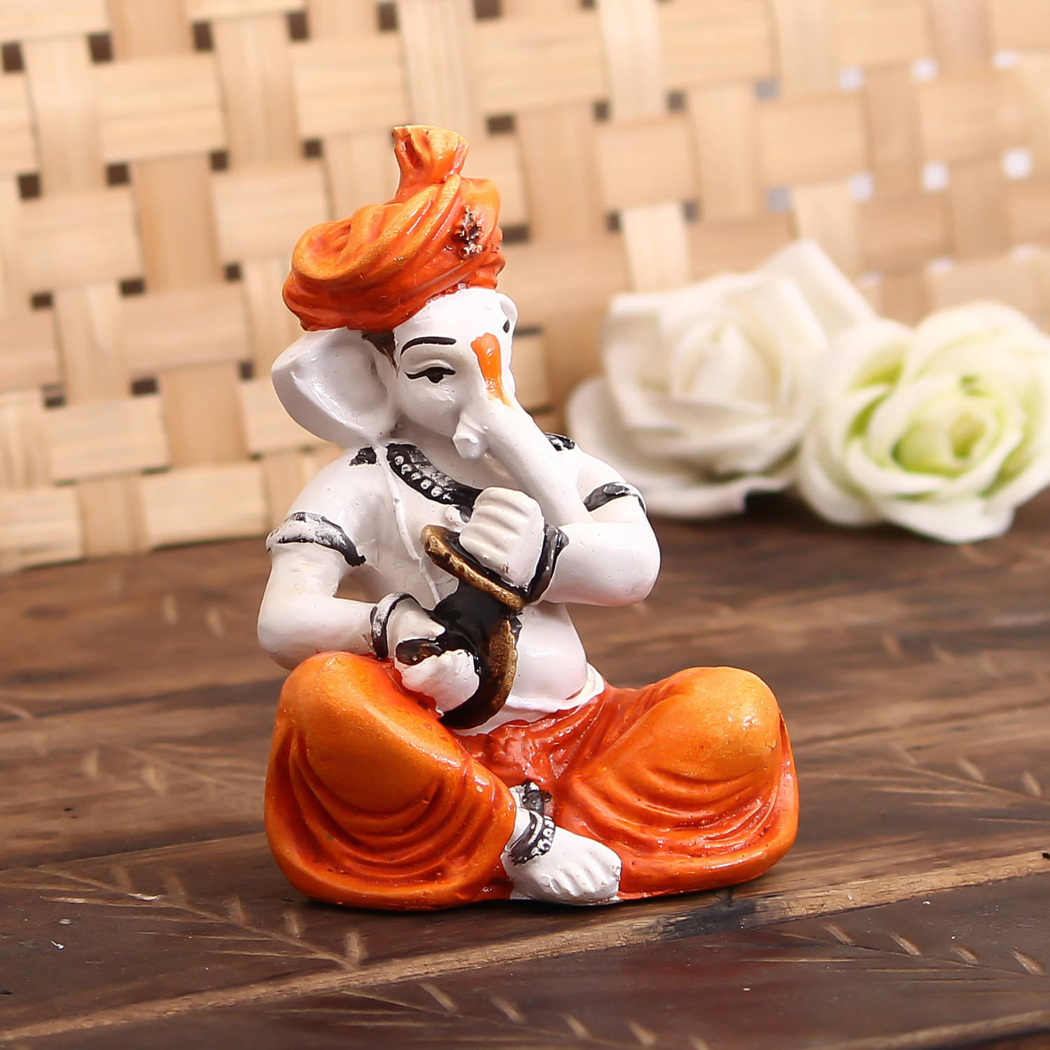 eCraftIndia Orange & Off-White Lord Ganesha Playing Manjira Showpiece     			eCraftIndia Orange & Off-White Lord Ganesha Playing Manjira Showpiece