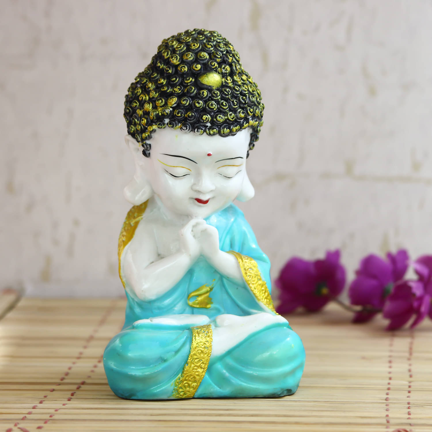 eCraftIndia Sea Green & Black Handcrafted Praying Monk Buddha Showpiece     			eCraftIndia Sea Green & Black Handcrafted Praying Monk Buddha Showpiece