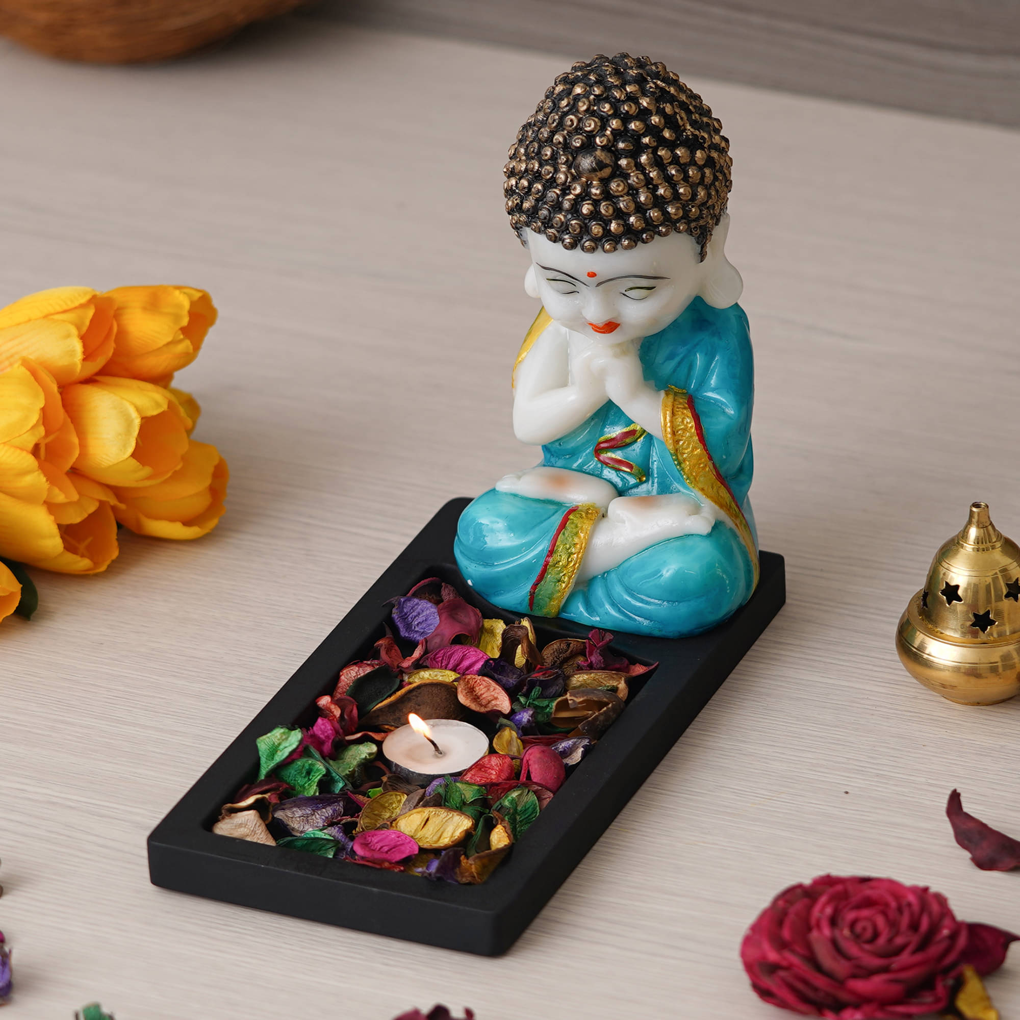 eCraftIndia Black & Blue Textured Gautam Buddha Showpiece With Tea-Light Holder     			eCraftIndia Black & Blue Textured Gautam Buddha Showpiece With Tea-Light Holder
