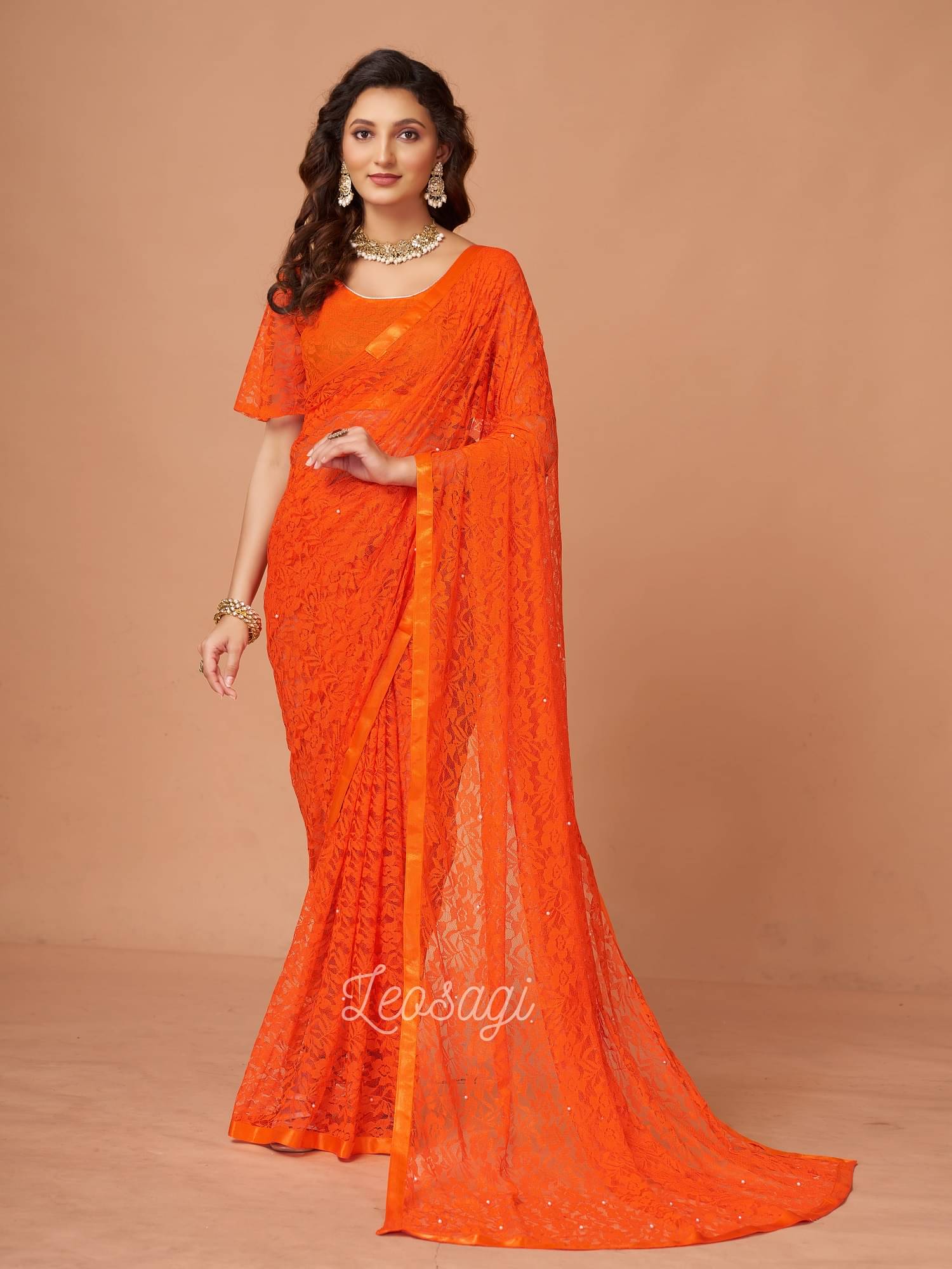     			VERVIZA Net Printed Saree Without Blouse Piece ( Orange )