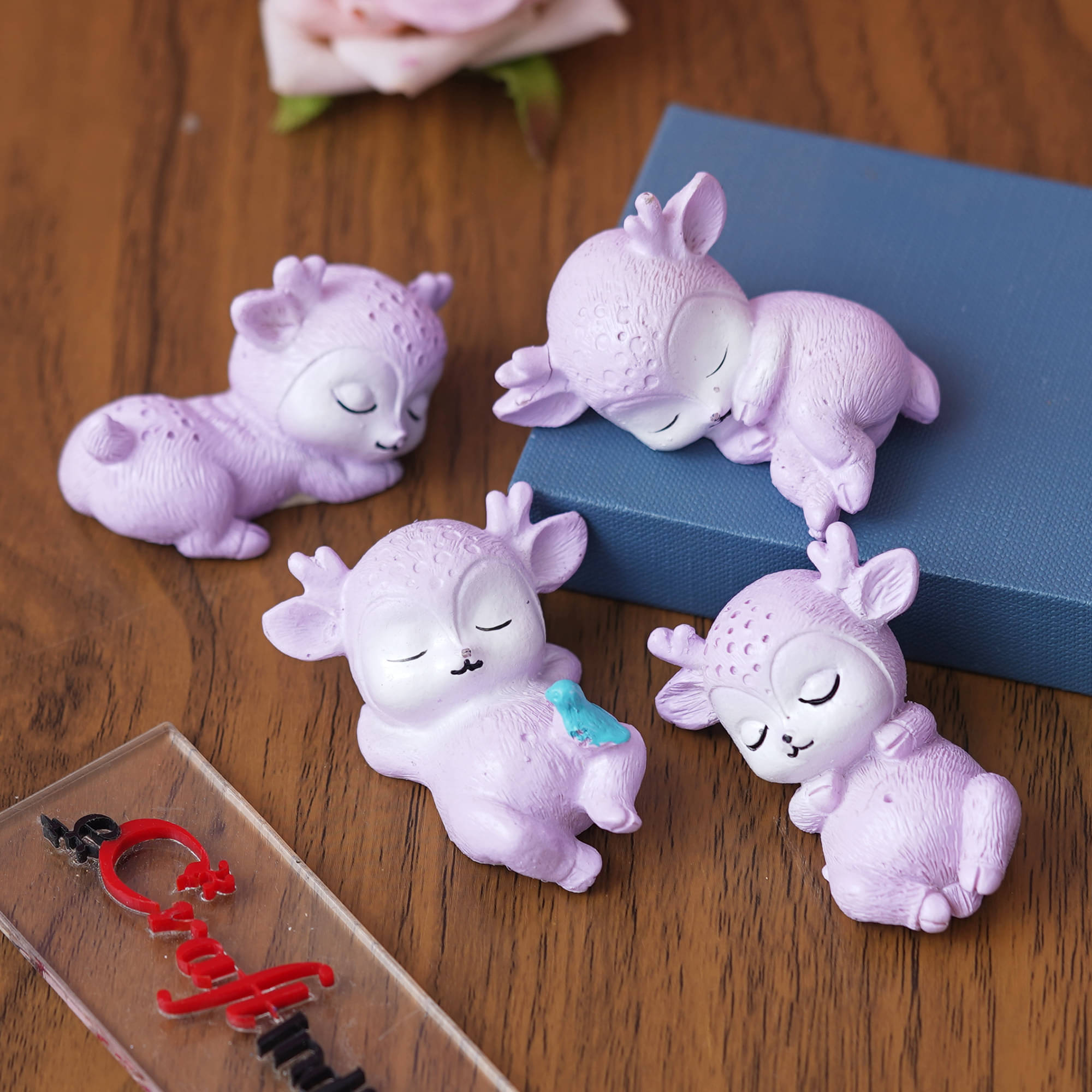 eCraftIndia Lavender 4 Pieces Cute Sleeping Deer Statues Figurine Showpiece eCraftIndia Lavender 4 Pieces Cute Sleeping Deer Statues Figurine Showpiece