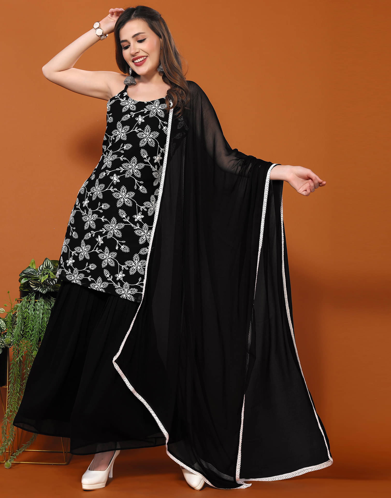 Skylee Georgette Embroidered Kurti With Sharara And Gharara Women's Stitched Salwar Suit - Black ( Pack of 1 ) Skylee Georgette Embroidered Kurti With Sharara And Gharara Women's Stitched Salwar Suit - Black ( Pack of 1 )