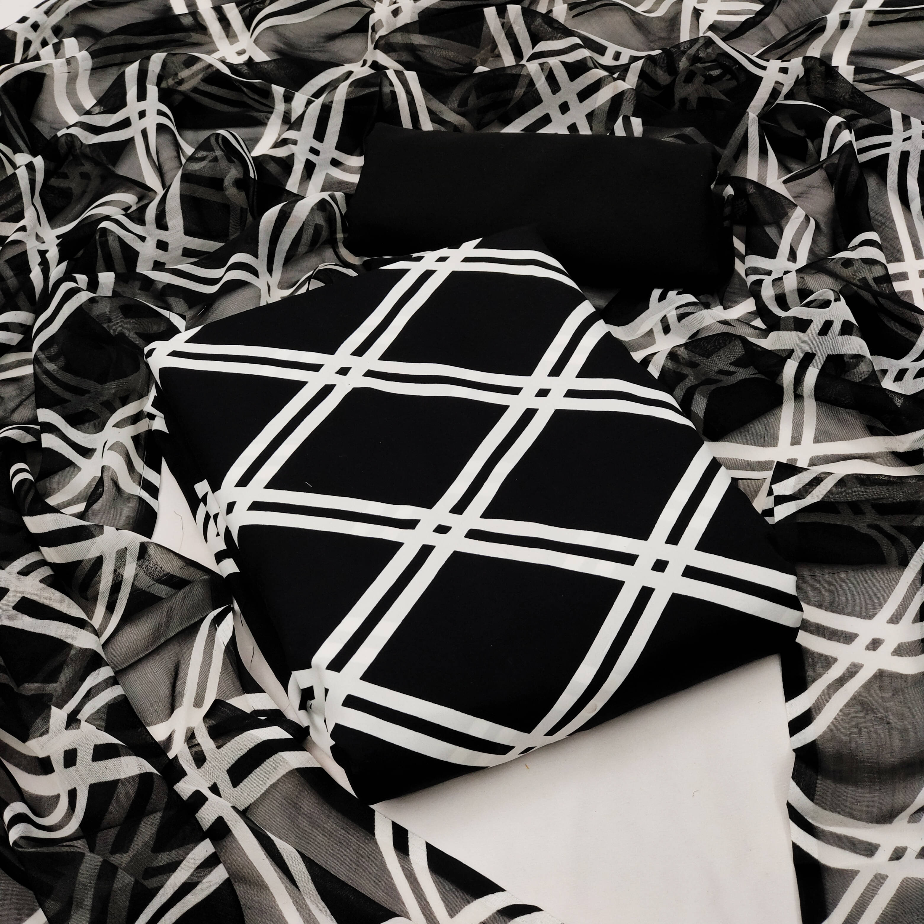 Kashvi Unstitched Crepe Checks Dress Material - Black ( Pack of 1 )     			Kashvi Unstitched Crepe Checks Dress Material - Black ( Pack of 1 )