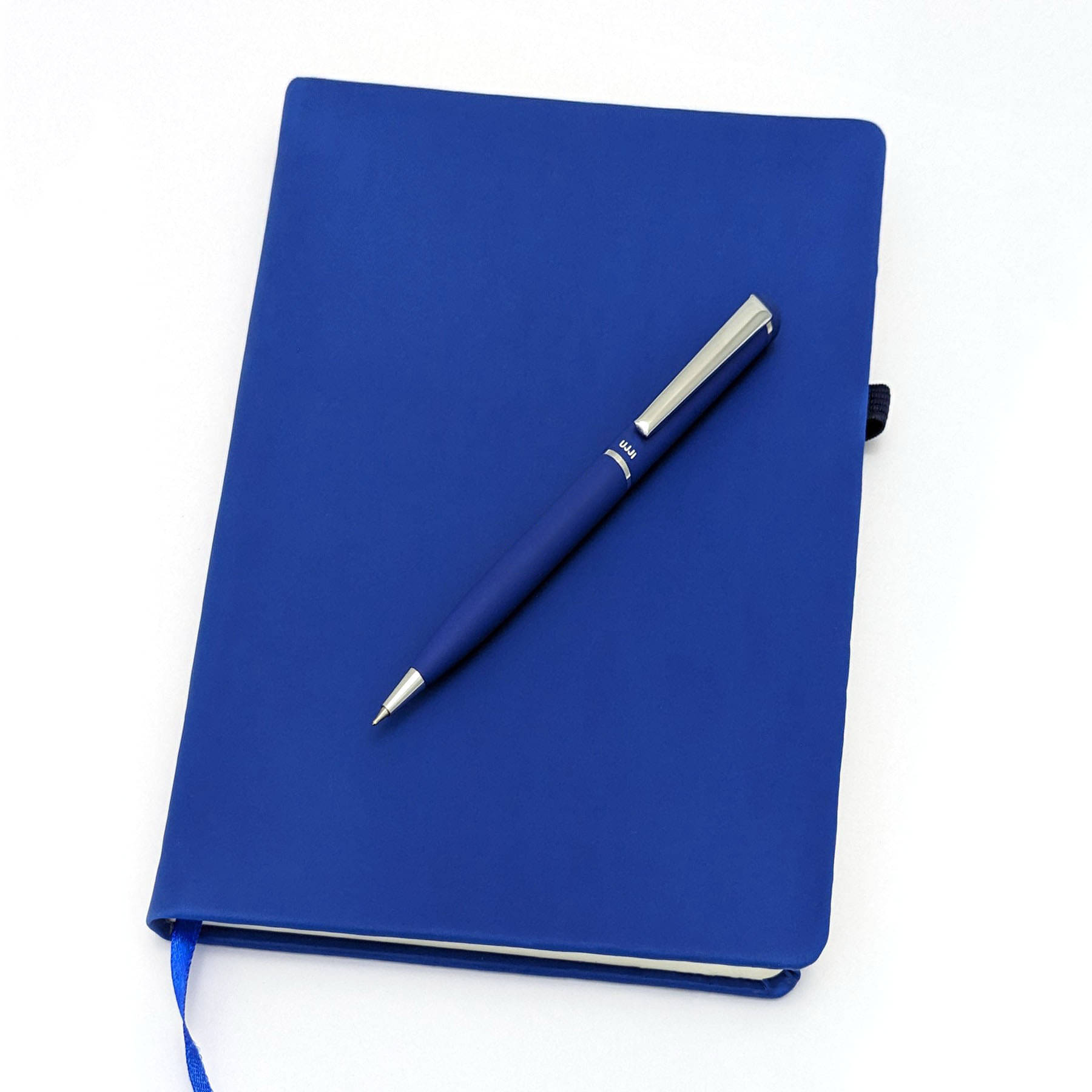 UJJi Metal Pen with Hard Cover Notebook in PU Leather with Elastic Closure and Pen Loop     			UJJi Metal Pen with Hard Cover Notebook in PU Leather with Elastic Closure and Pen Loop