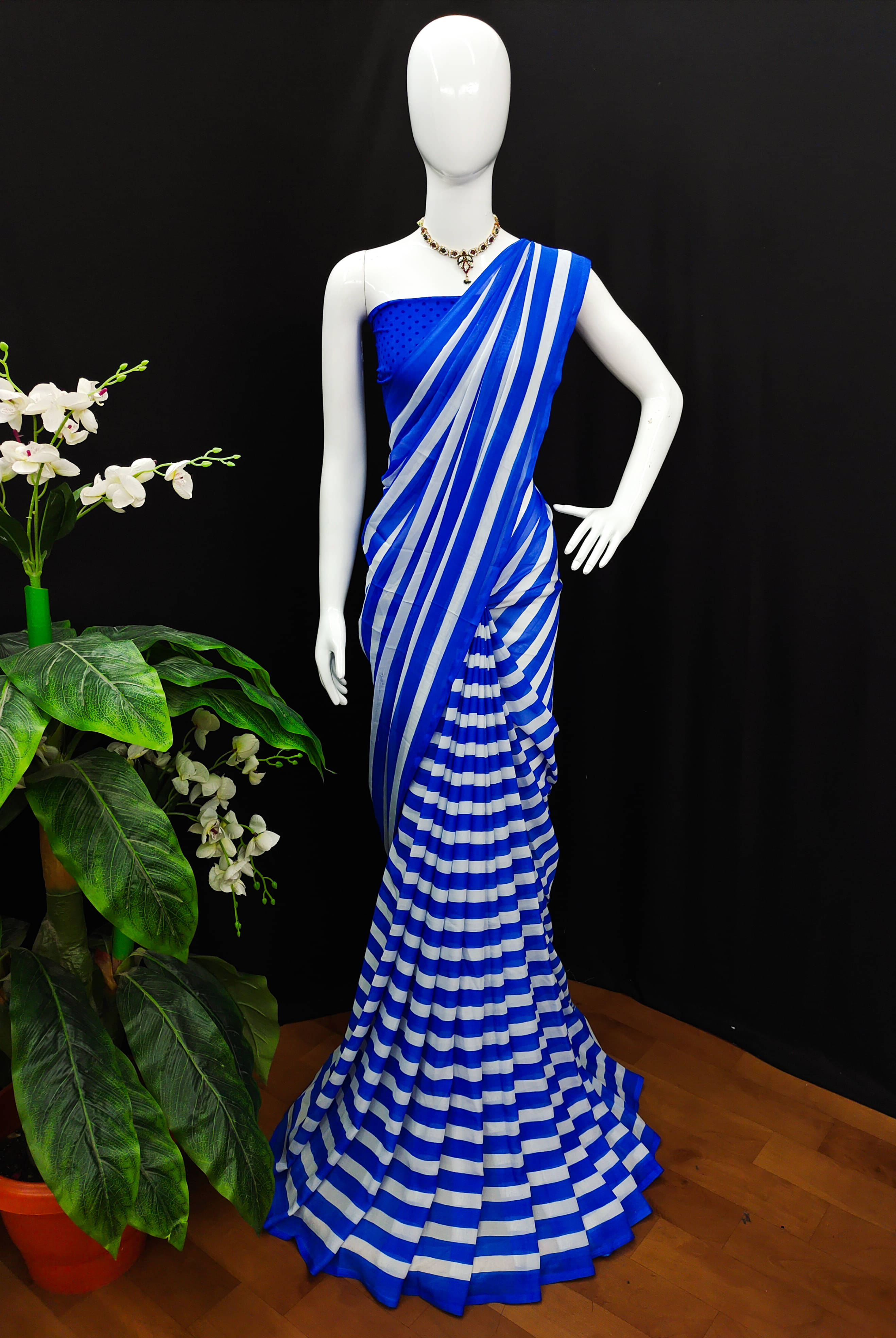 ANAND SAREES Georgette Printed Saree With Unstitched Blouse Piece ( Blue ) ANAND SAREES Georgette Printed Saree With Unstitched Blouse Piece ( Blue )