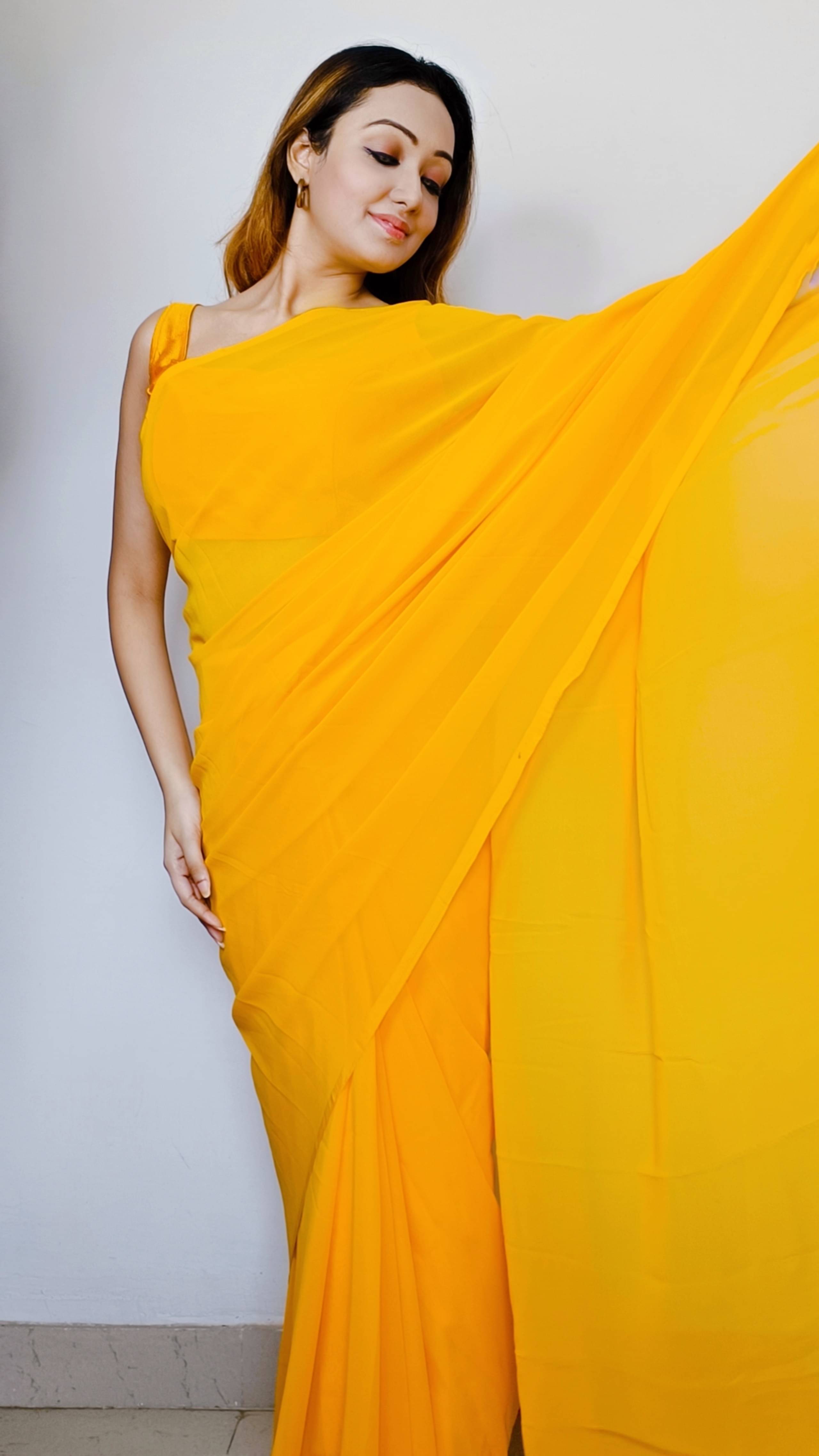 ANAND SAREES Georgette Solid Saree With Unstitched Blouse Piece ( Yellow ) ANAND SAREES Georgette Solid Saree With Unstitched Blouse Piece ( Yellow )