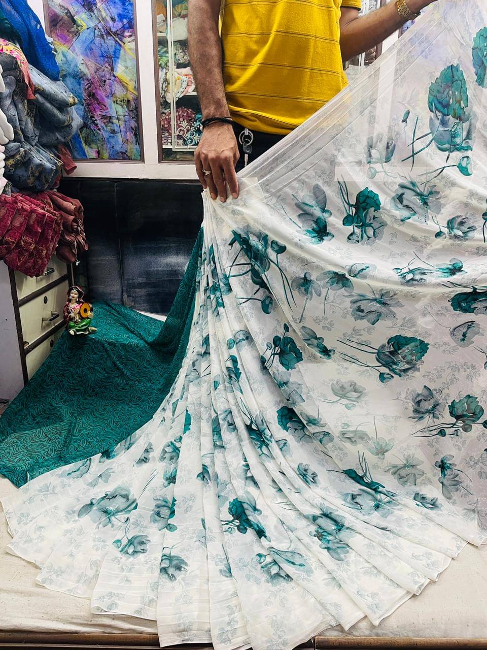 Bhuwal Fashion Georgette Printed Saree With Unstitched Blouse Piece ( Turquoise )     			Bhuwal Fashion Georgette Printed Saree With Unstitched Blouse Piece ( Turquoise )