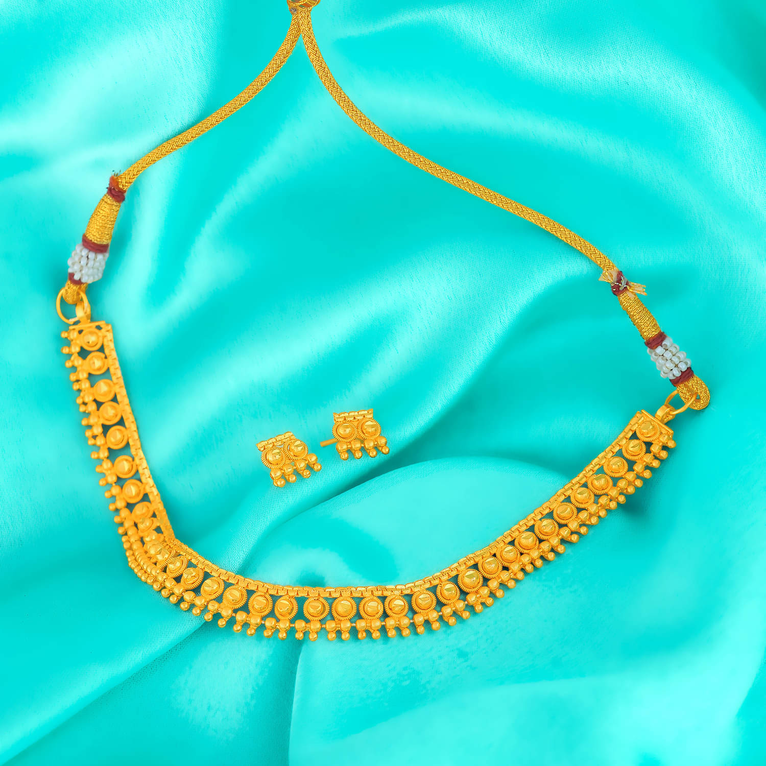     			LUV FASHION Golden Brass Necklace Set ( Pack of 2 )