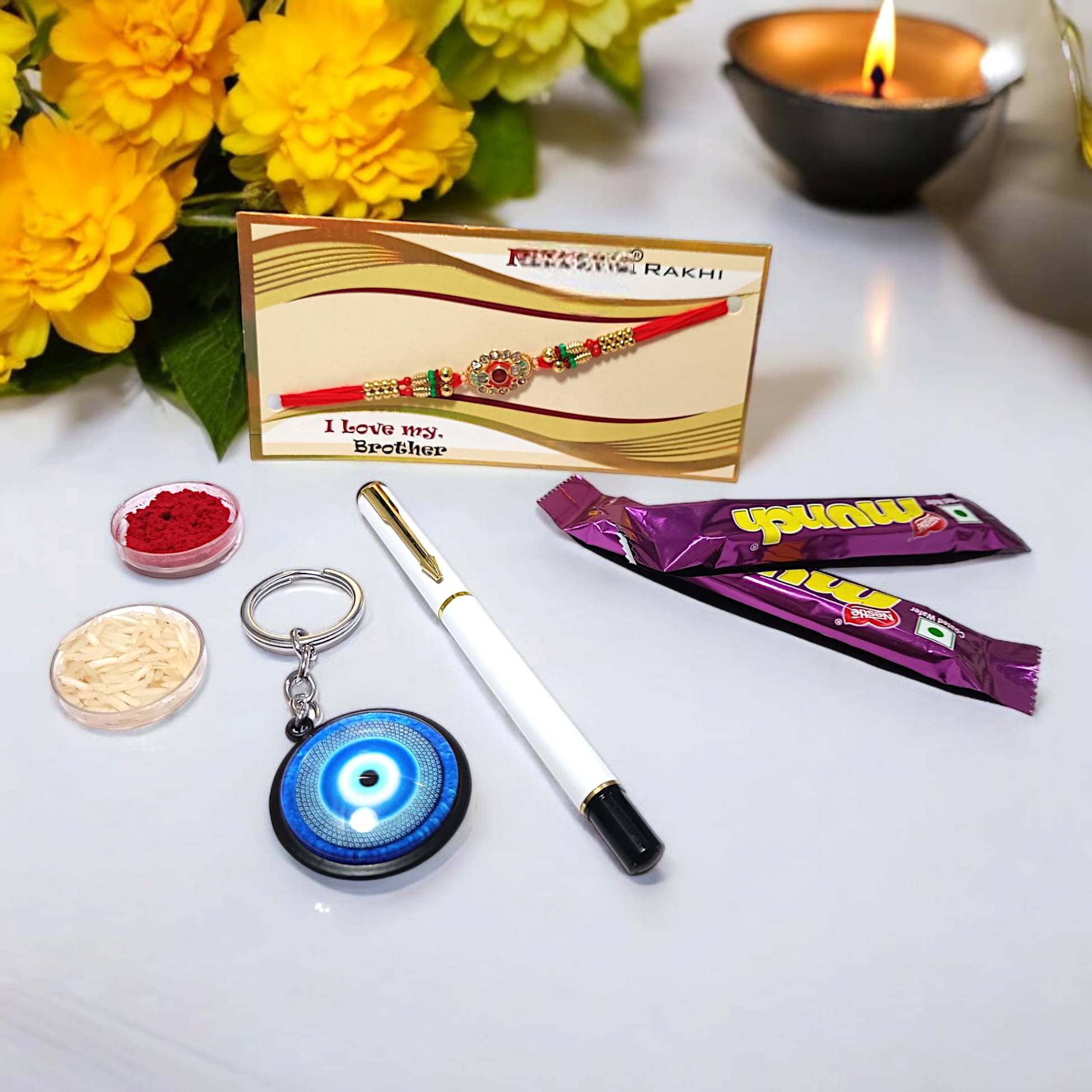     			auteur 801 Stylish Black Roller Ball Pen and Designer Rakhi Gift Set for Brother With Evil Eye Keychain, Chocolates, Roli, Mishri and Rice.