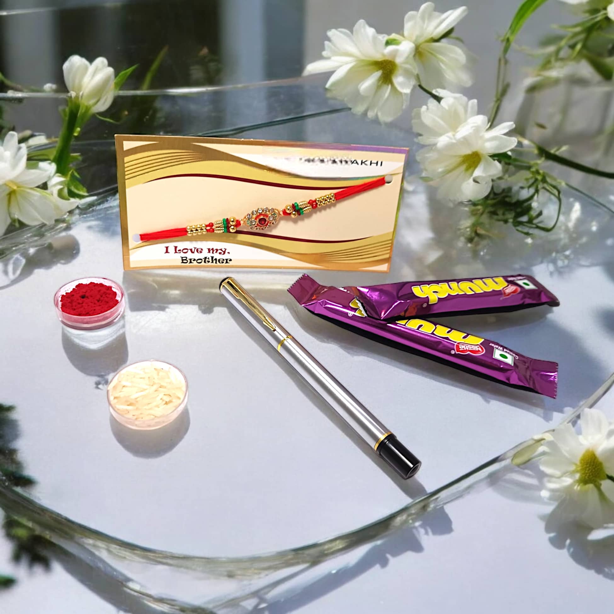 auteur 801 Stylish Black Roller Ball Pen and Designer Rakhi Gift Set for Brother With Chocolates, Roli, Mishri and Rice.