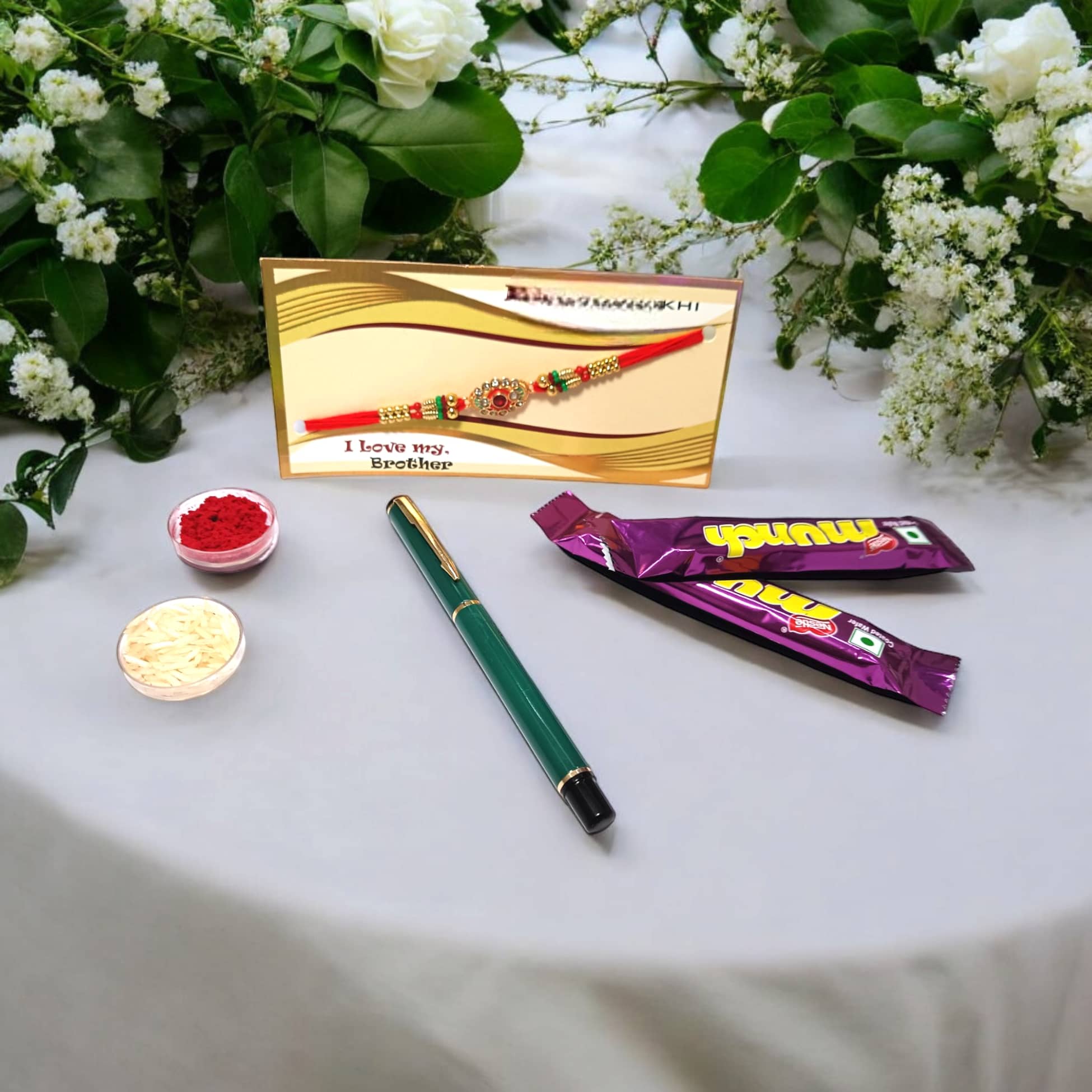auteur 801 Stylish Black Roller Ball Pen and Designer Rakhi Gift Set for Brother With Chocolates, Roli, Mishri and Rice.