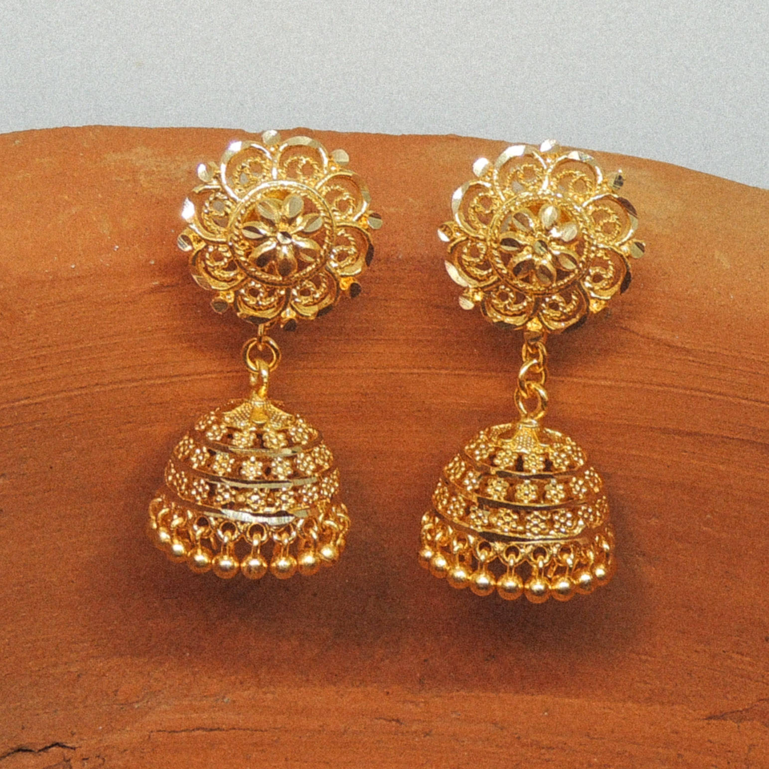     			LUV FASHION Golden Jhumki Earrings ( Pack of 1 )