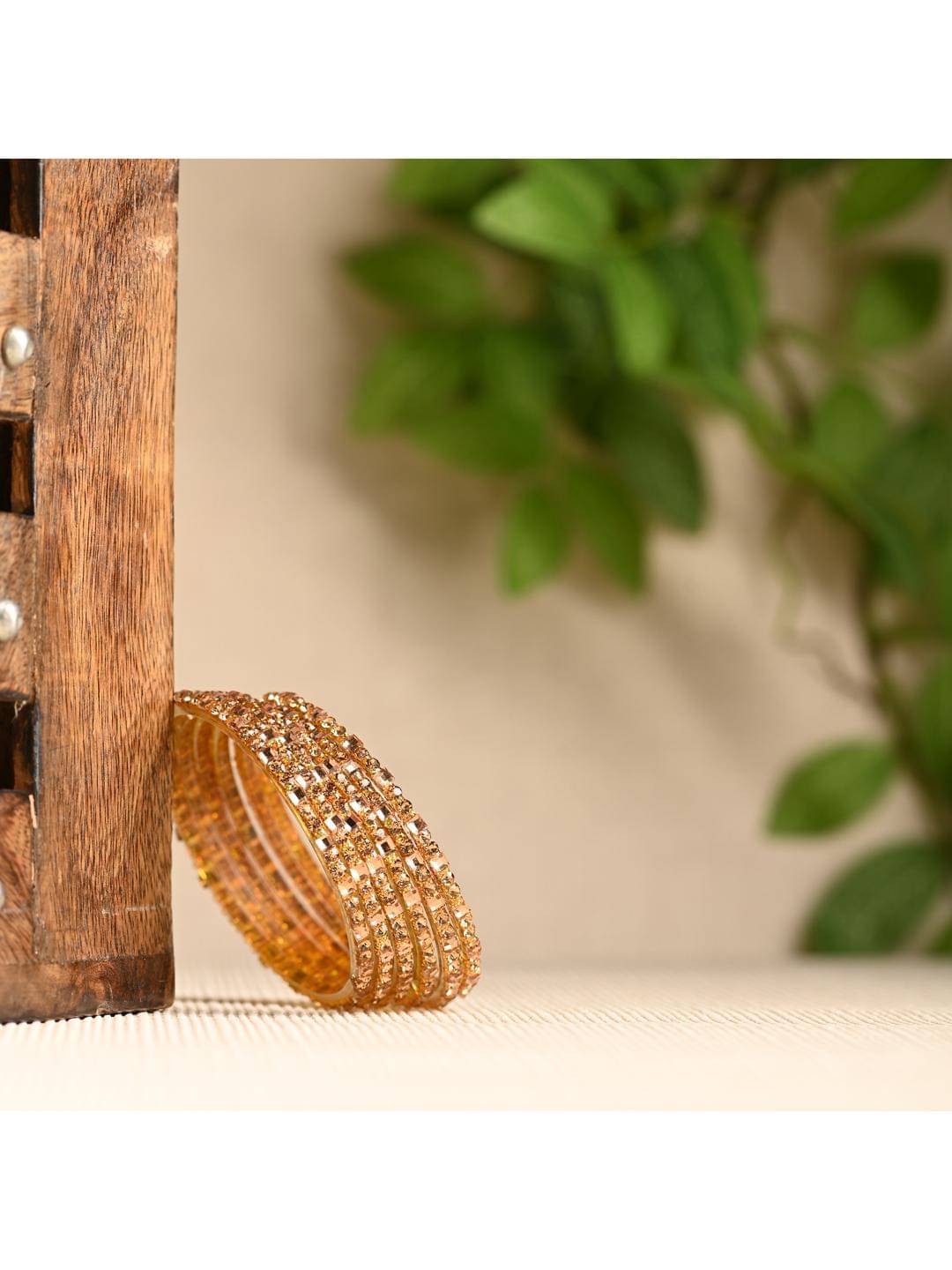 Somil Gold Bangle Set ( Pack of 12 ) Somil Gold Bangle Set ( Pack of 12 )