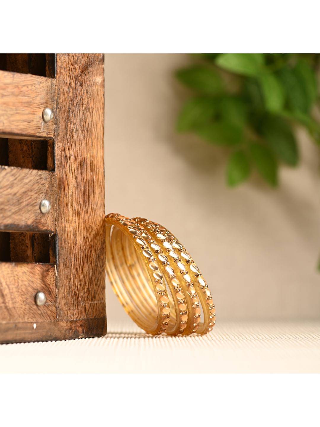 Somil Gold Bangle Set ( Pack of 12 ) Somil Gold Bangle Set ( Pack of 12 )