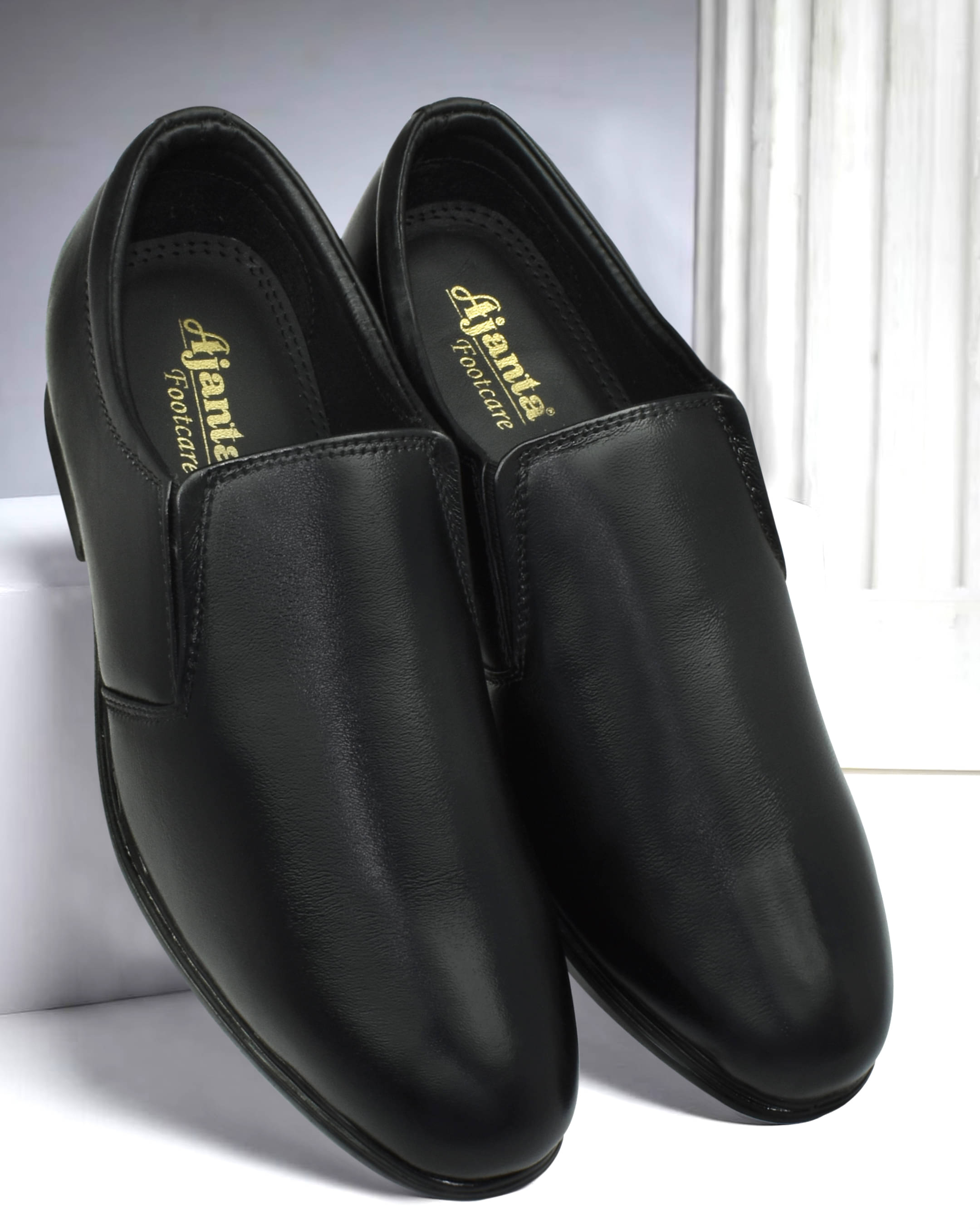     			Ajanta Black Men's Slip On Formal Shoes