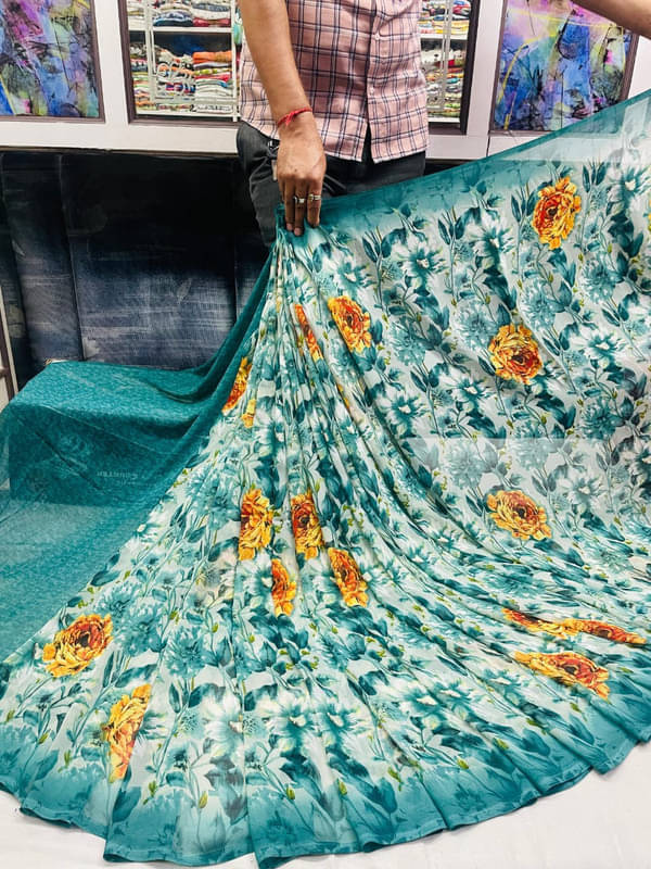     			Sitanjali Georgette Printed Saree With Unstitched Blouse Piece ( Teal )