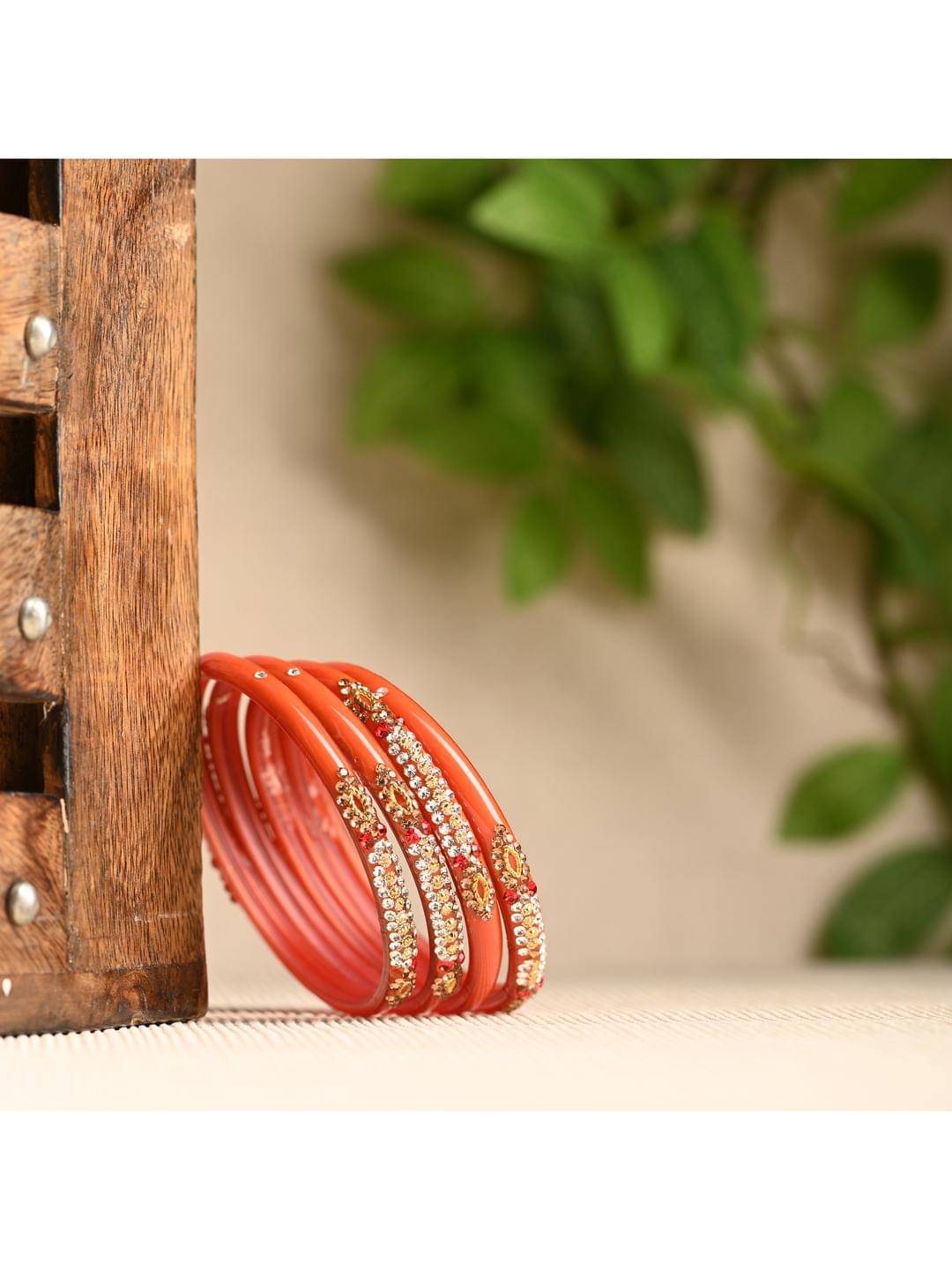 Somil Orange Bangle Set ( Pack of 12 ) Somil Orange Bangle Set ( Pack of 12 )
