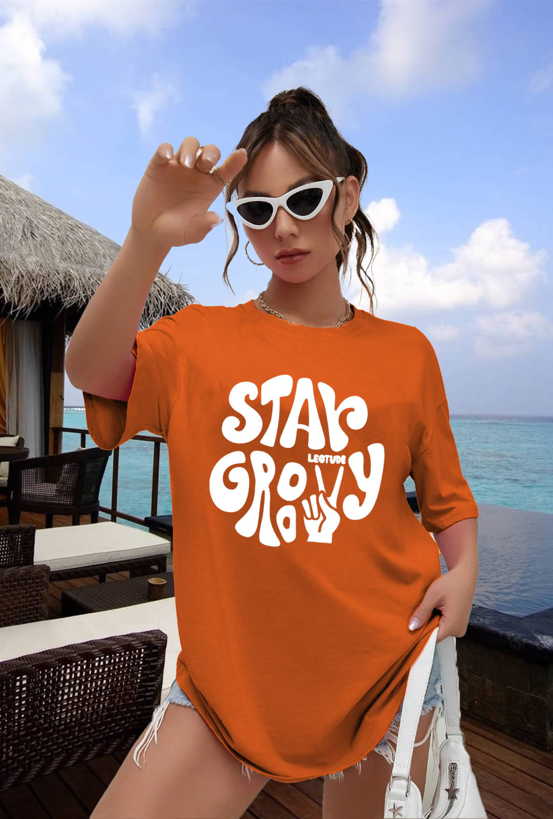     			Leotude Women Cotton Blend Printed Oversized Fit Round Neck T-Shirt ( Orange )