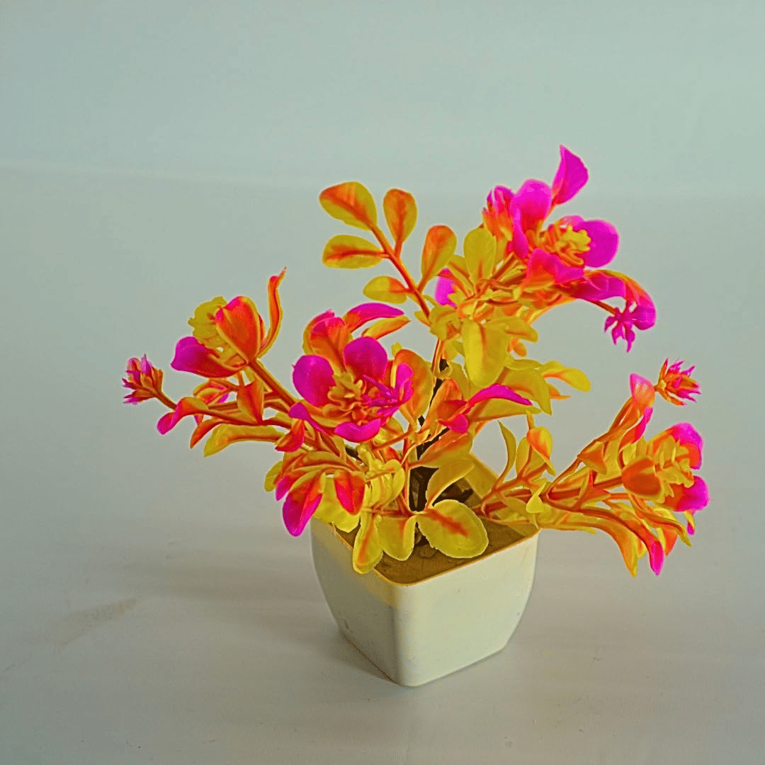 Artificial Neon Pink and Yellow Plant in White Ceramic Pot, Modern Contemporary Decorative Faux Plant, Indoor Use, Maintenance-Free Artificial Neon Pink and Yellow Plant in White Ceramic Pot, Modern Contemporary Decorative Faux Plant, Indoor Use, Maintenance-Free