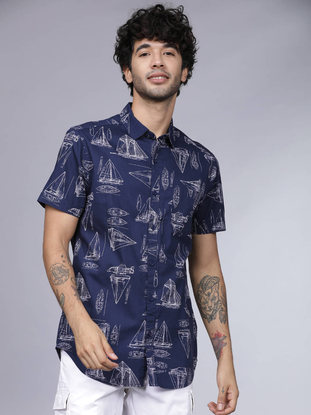 Highlander 100% Cotton Slim Fit Printed Half Sleeves Men's Casual Shirt - Multicolor ( Pack of 1 )     			Highlander 100% Cotton Slim Fit Printed Half Sleeves Men's Casual Shirt - Multicolor ( Pack of 1 )
