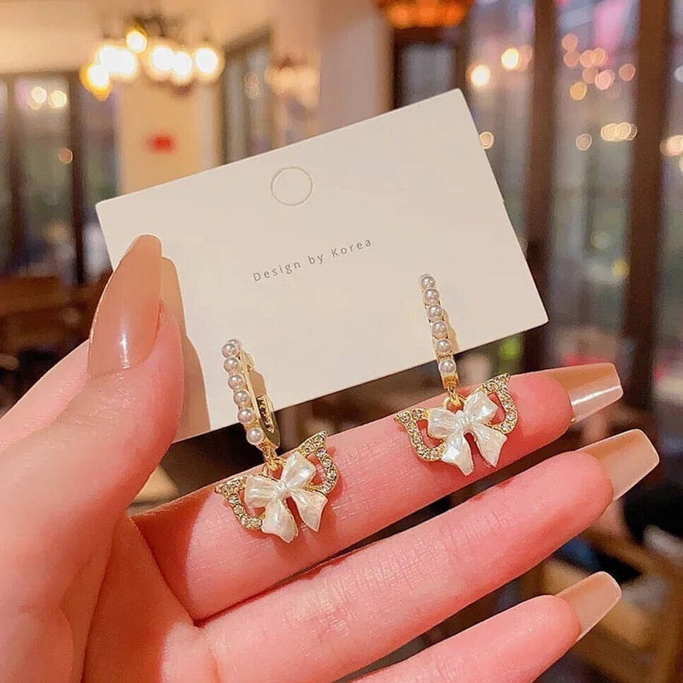     			Lady Raiment Golden Stud Earrings ( Pack of 1 )