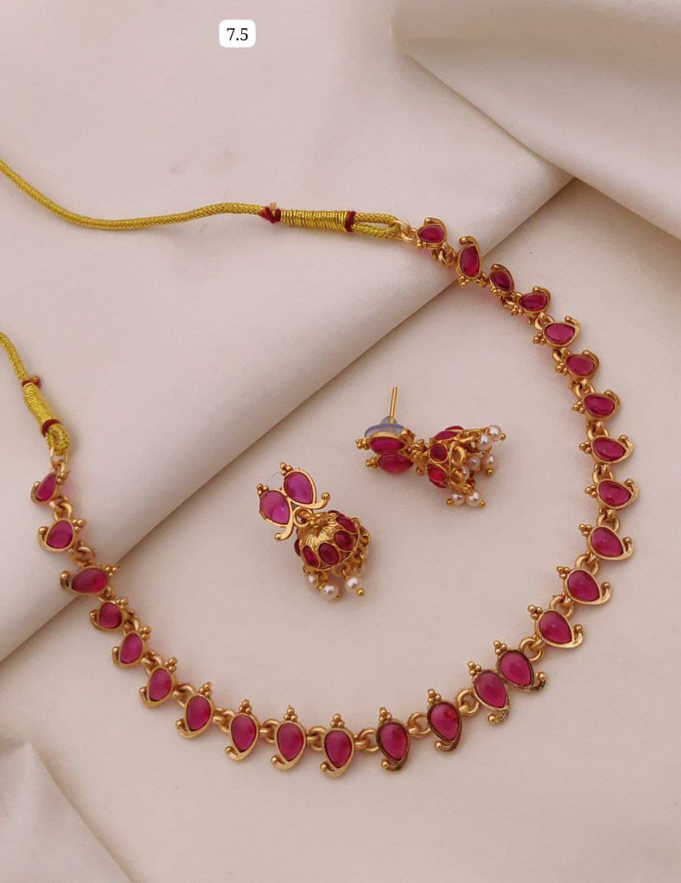     			GlowNest Red Brass Necklace Set ( Pack of 1 )