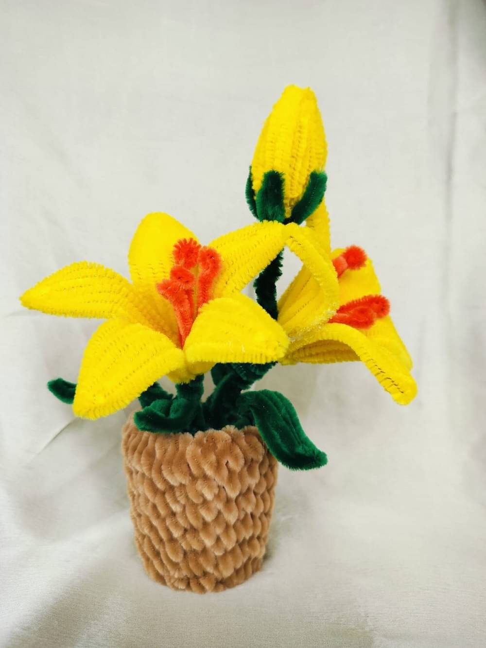     			yellow pipe cleaner flower pot