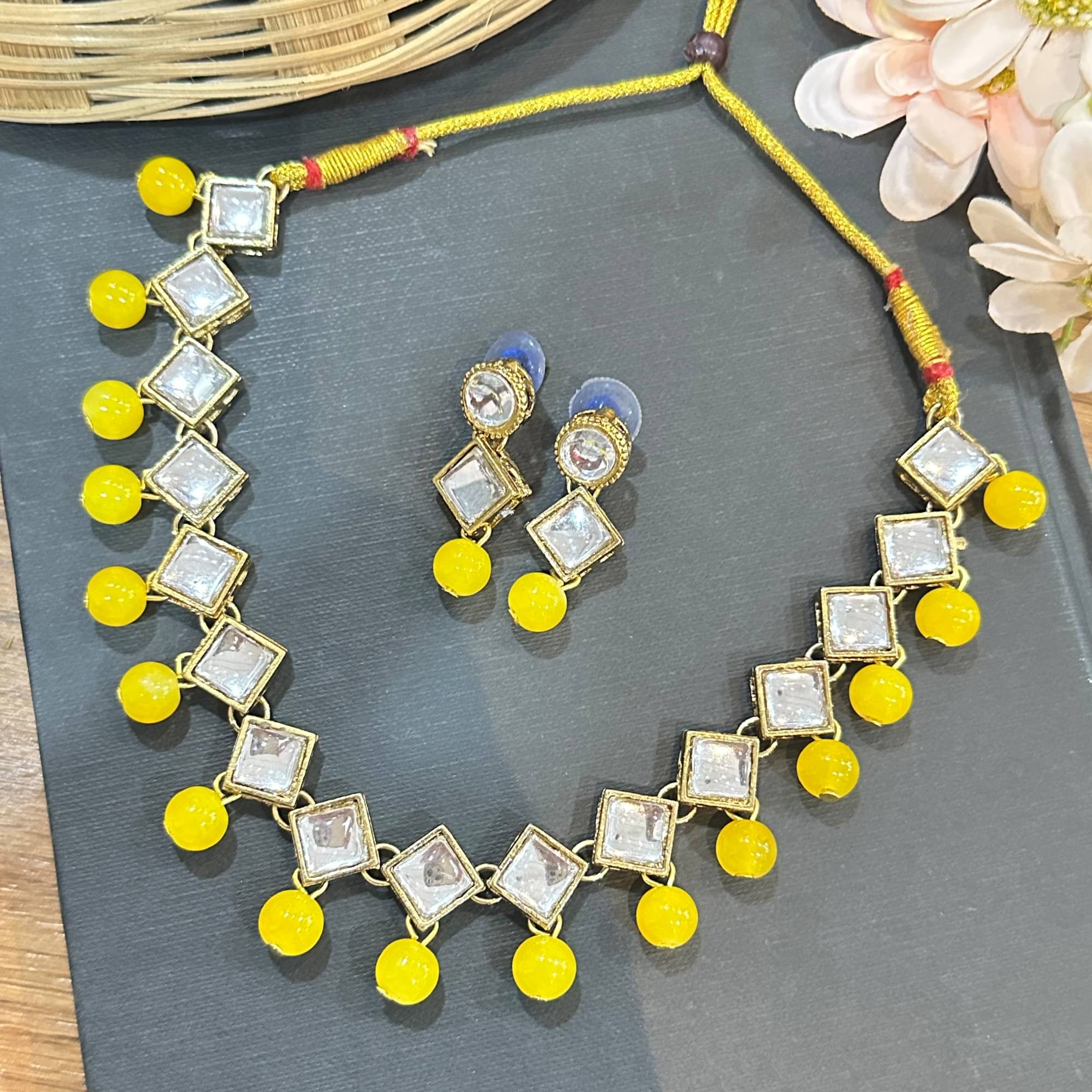     			JN HANDICRAFT Yellow Alloy Necklace Set ( Pack of 1 )
