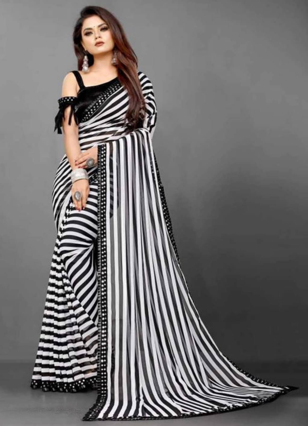 Generics Lycra Striped Regular Saree With Stitched Blouse ( Black,White ) Generics Lycra Striped Regular Saree With Stitched Blouse ( Black,White )