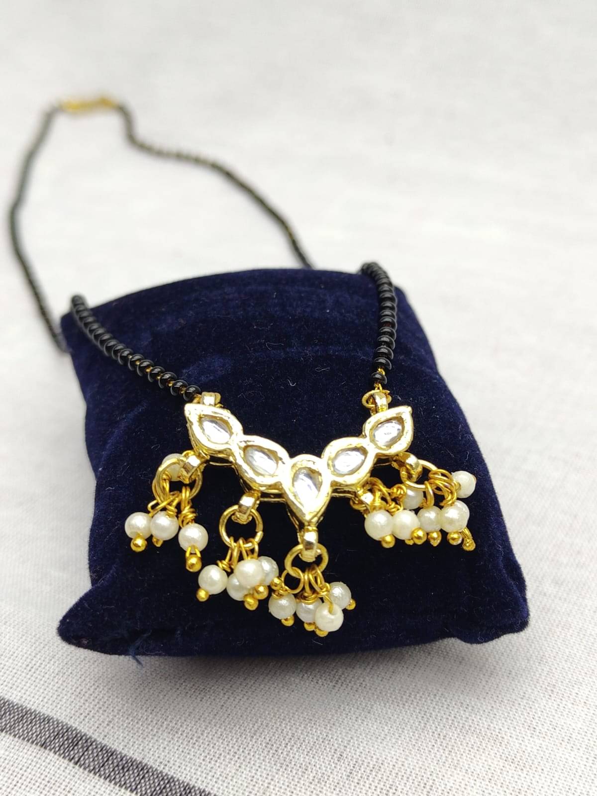 NITASHA CREATIONS7 Golden Mangalsutra ( Pack of 1 )     			NITASHA CREATIONS7 Golden Mangalsutra ( Pack of 1 )