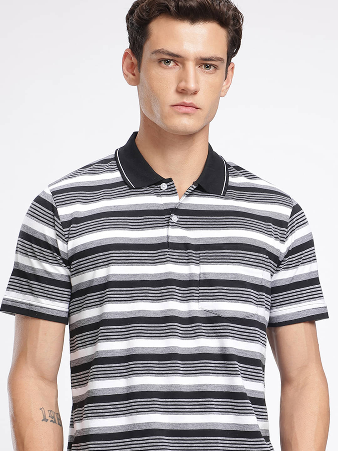     			XYRIS Men Cotton Blend Regular Fit Striped Polo T Shirt ( Black )