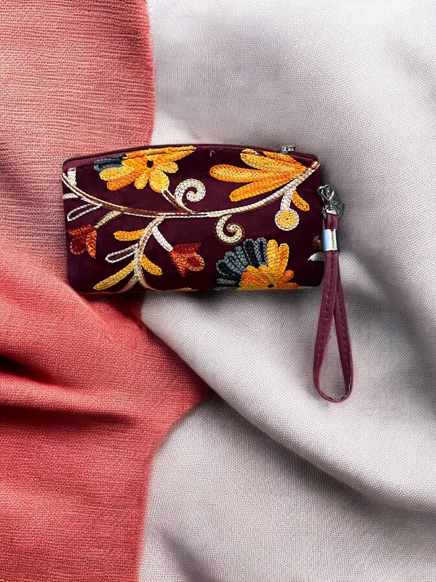     			Clearo Red Fabric Wristlet