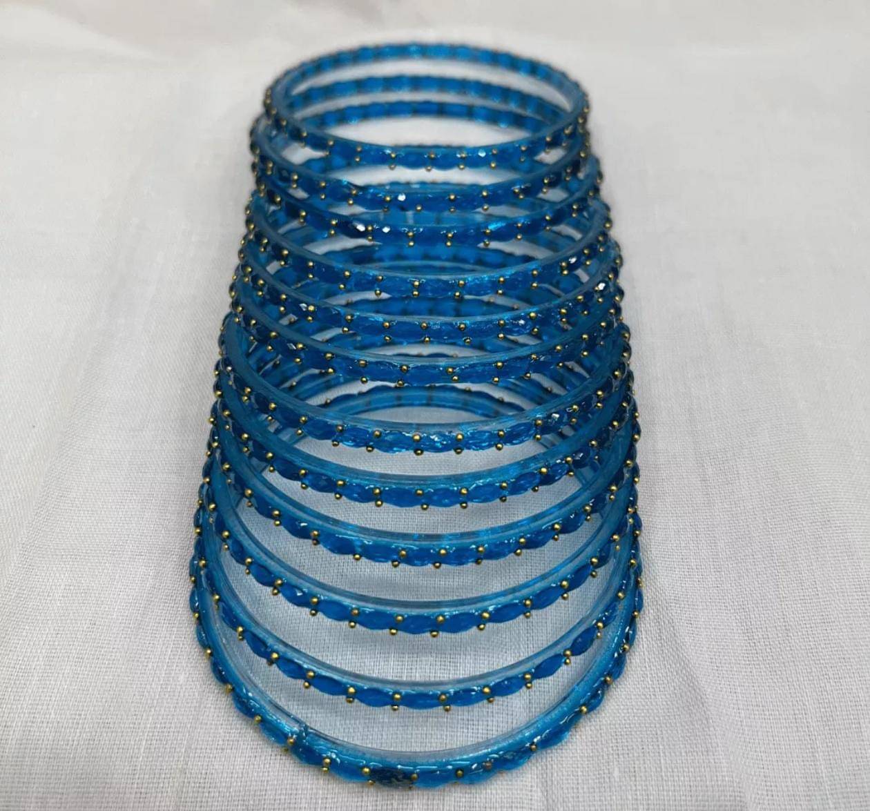 Divine Glass Blue Bangle Set ( Pack of 12 )     			Divine Glass Blue Bangle Set ( Pack of 12 )
