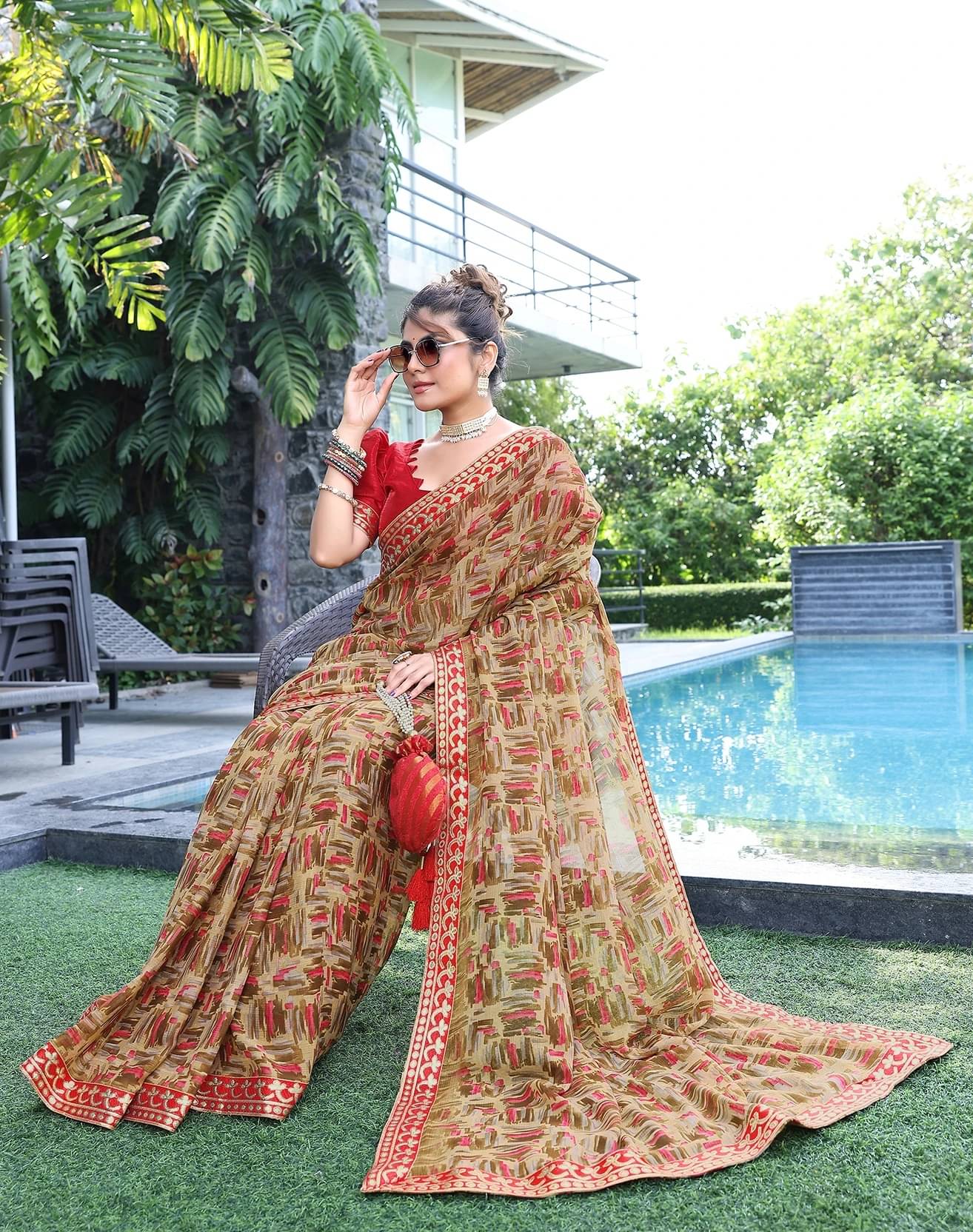     			Yashika Georgette Printed Regular Saree With Unstitched Blouse Piece ( Brown )
