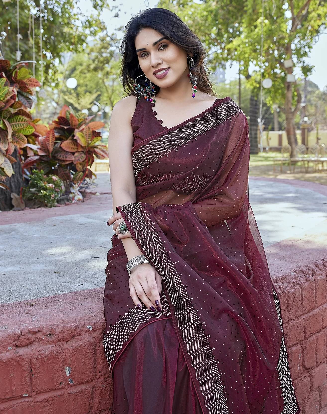 Yashika Tissue Embellished Regular Saree With Unstitched Blouse Piece ( Maroon ) Yashika Tissue Embellished Regular Saree With Unstitched Blouse Piece ( Maroon )