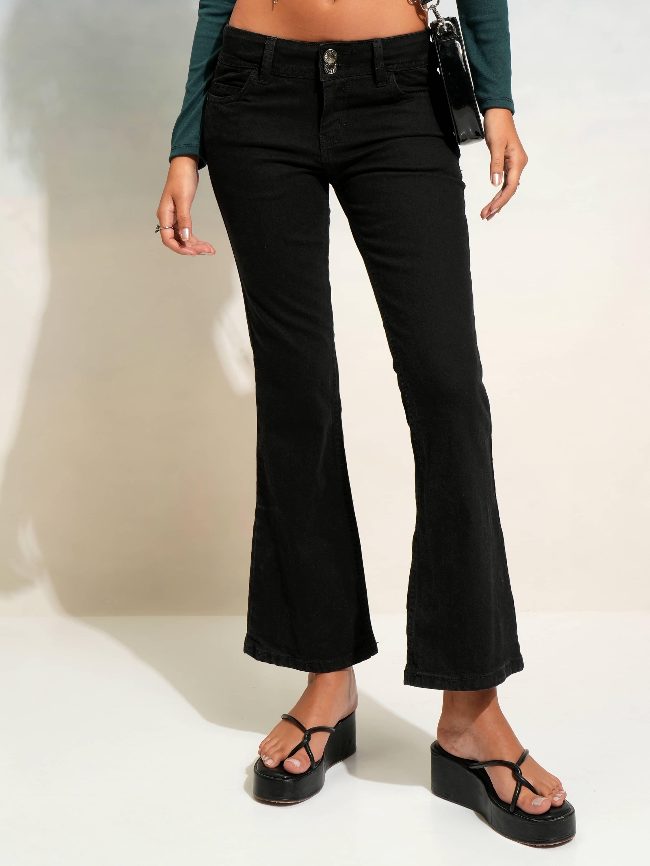     			Tokyo Talkies Women's Flared Mid-Rise Jeans ( Black )