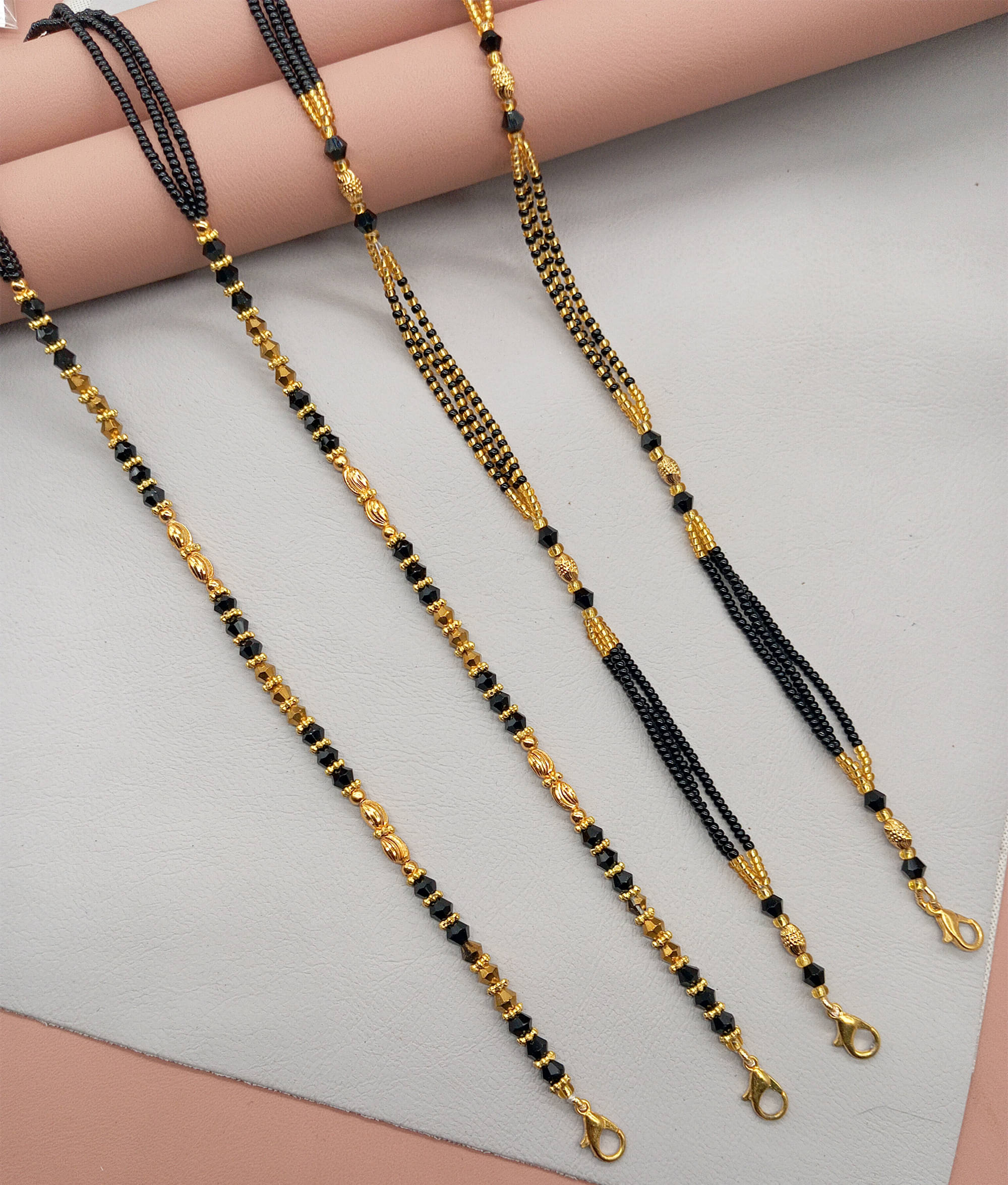 SHANKHRAJ MA LL Golden Mangalsutra ( Pack of 2 ) SHANKHRAJ MA LL Golden Mangalsutra ( Pack of 2 )