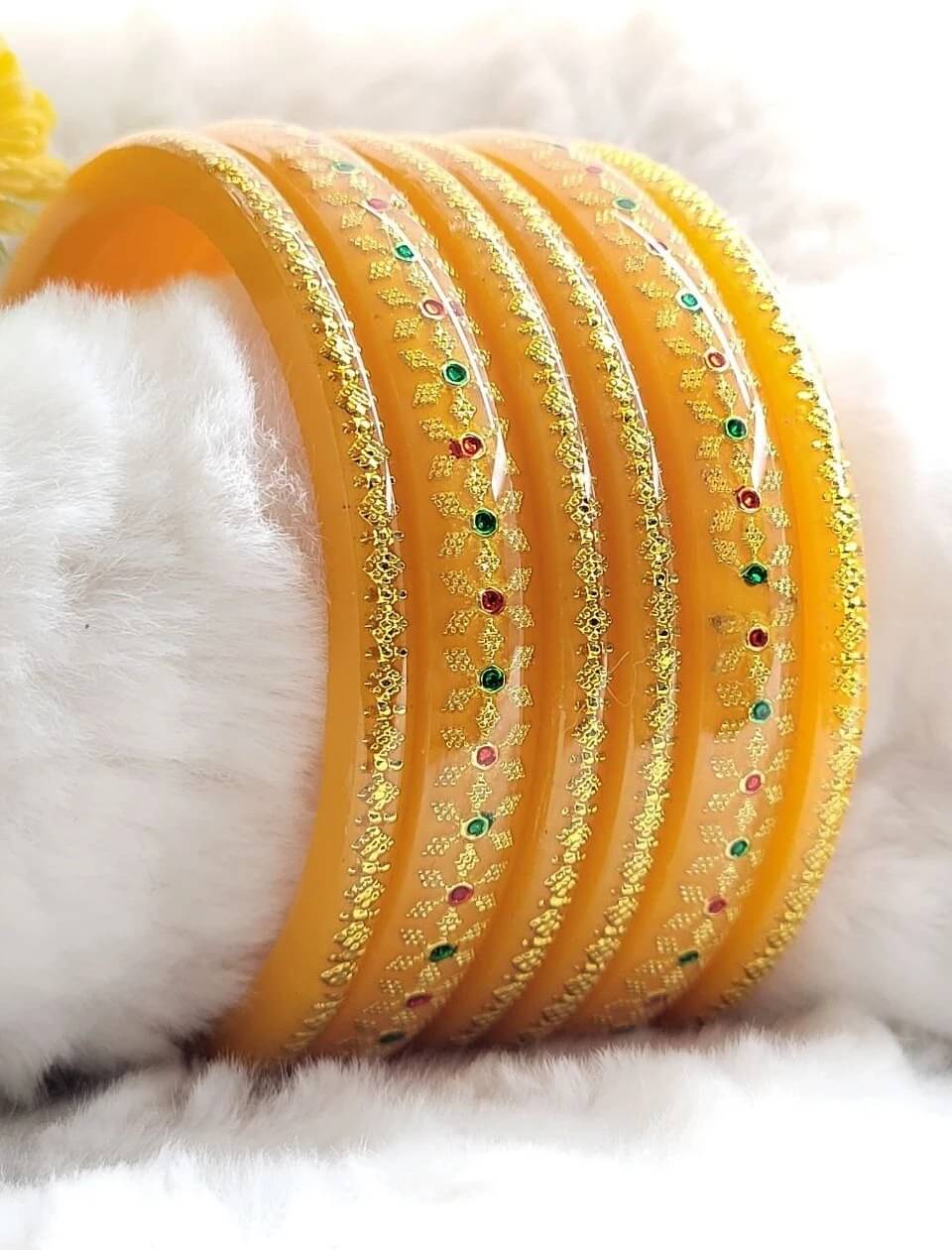 DHANOTIYA Yellow Bangle Set ( Pack of 6 ) DHANOTIYA Yellow Bangle Set ( Pack of 6 )